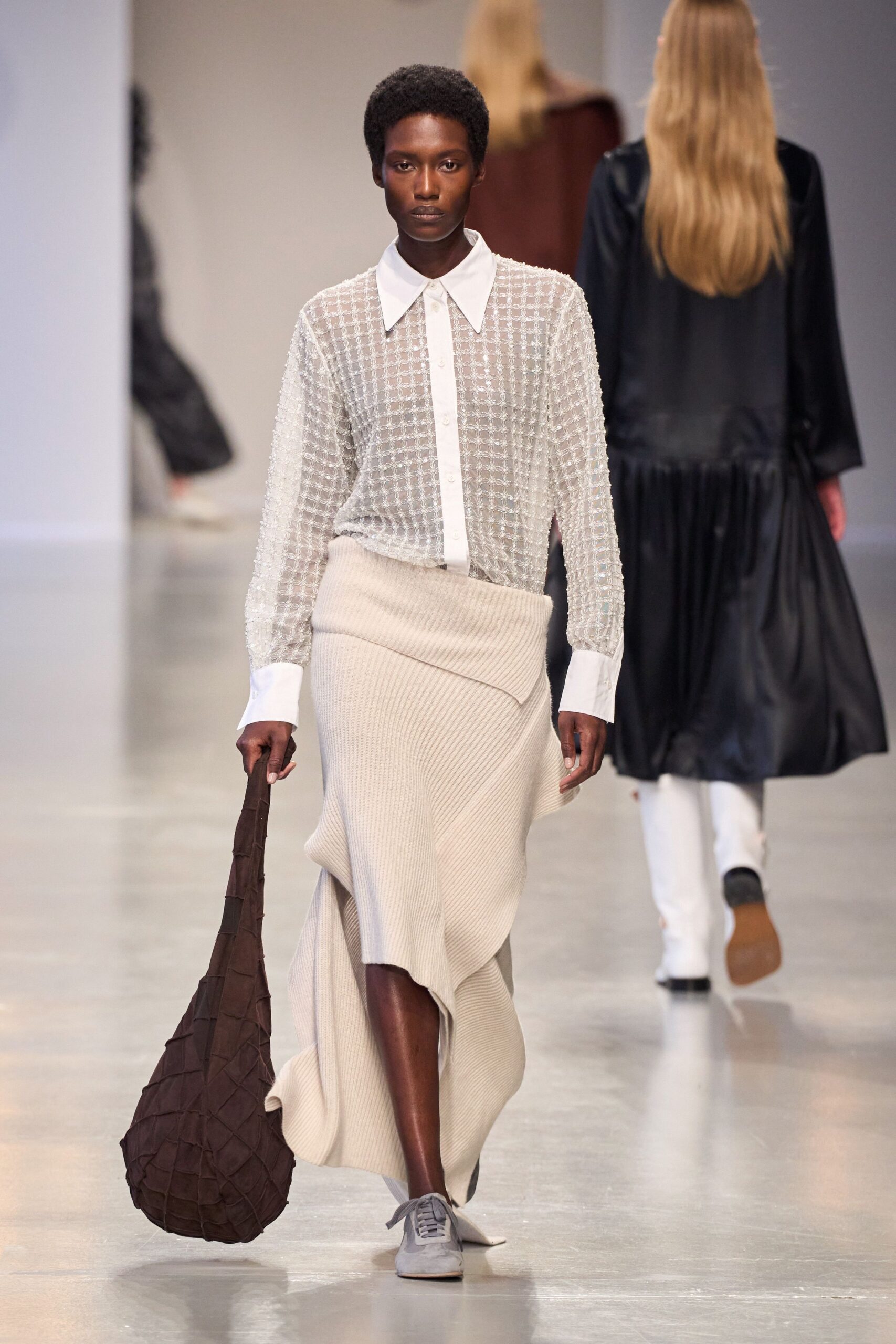 white collared shirt beige asymmetric skirt