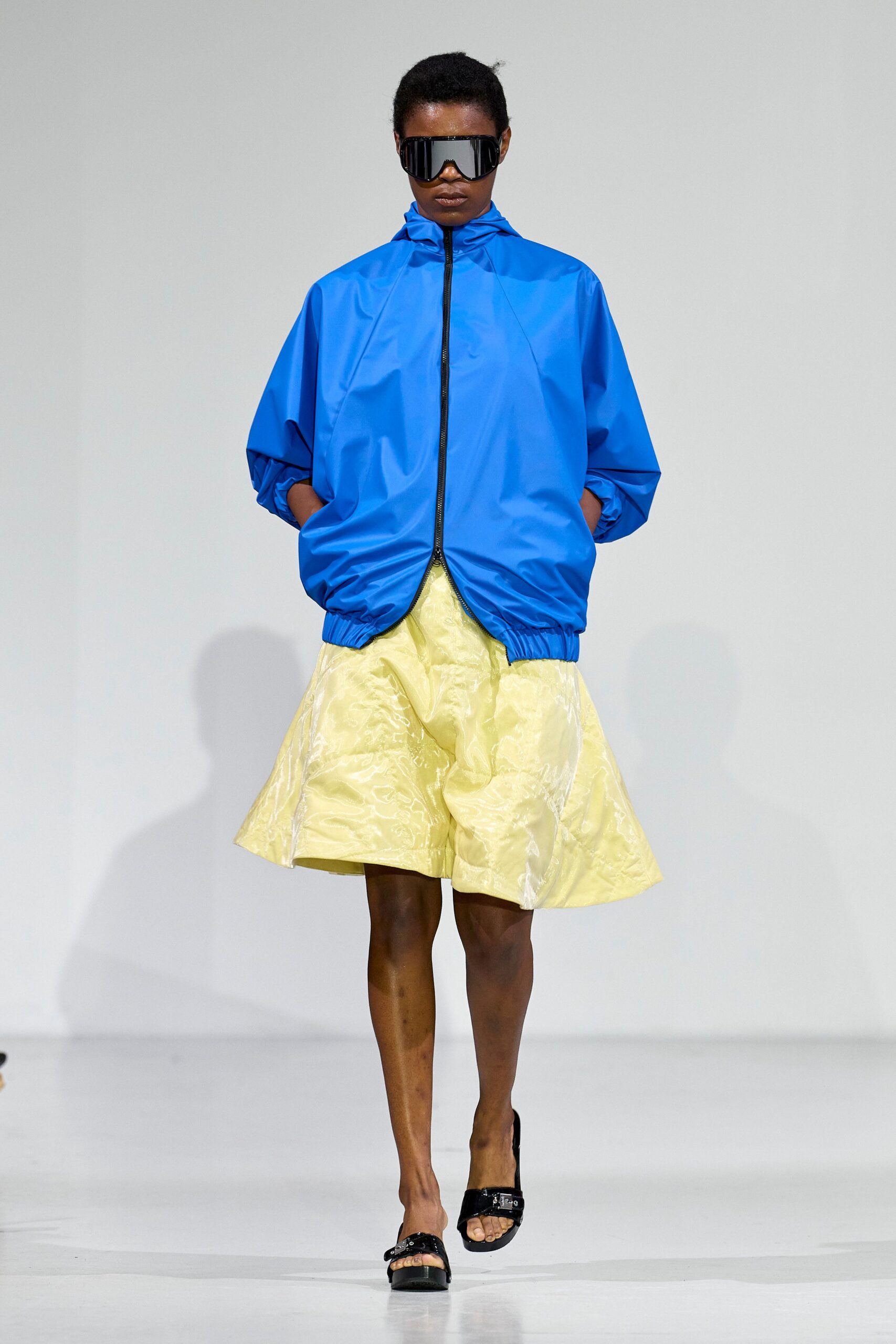 blue jacket yellow skirt