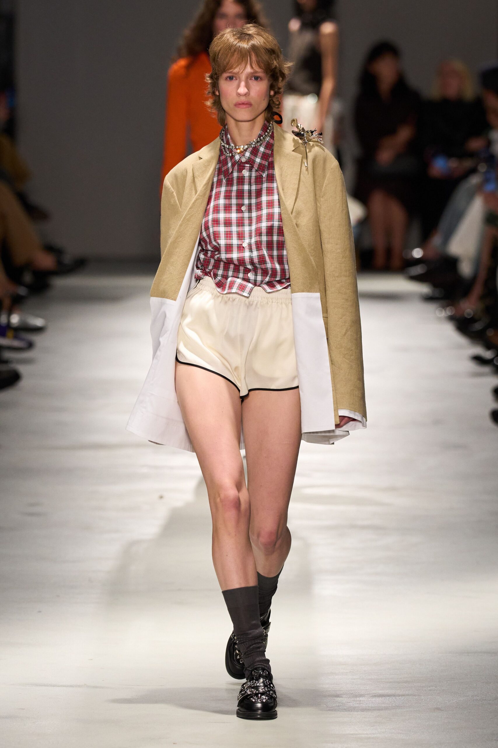 beige jacket with checked shirt
