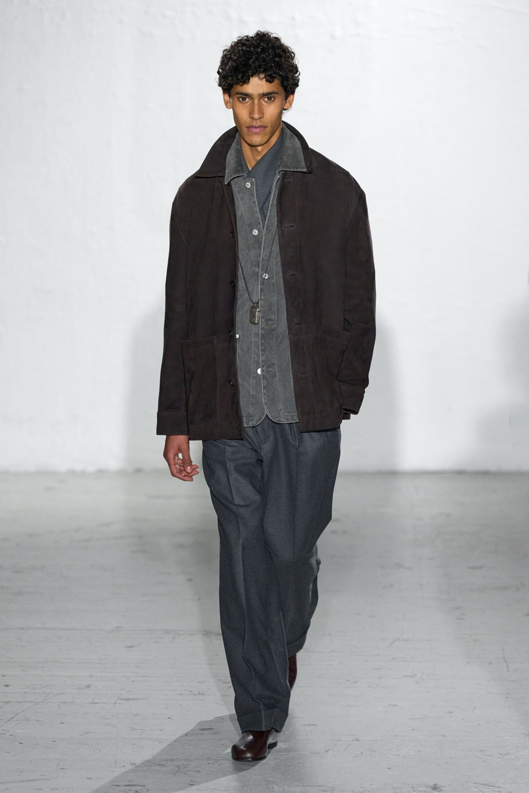 brown suede jacket gray shirt gray pants
