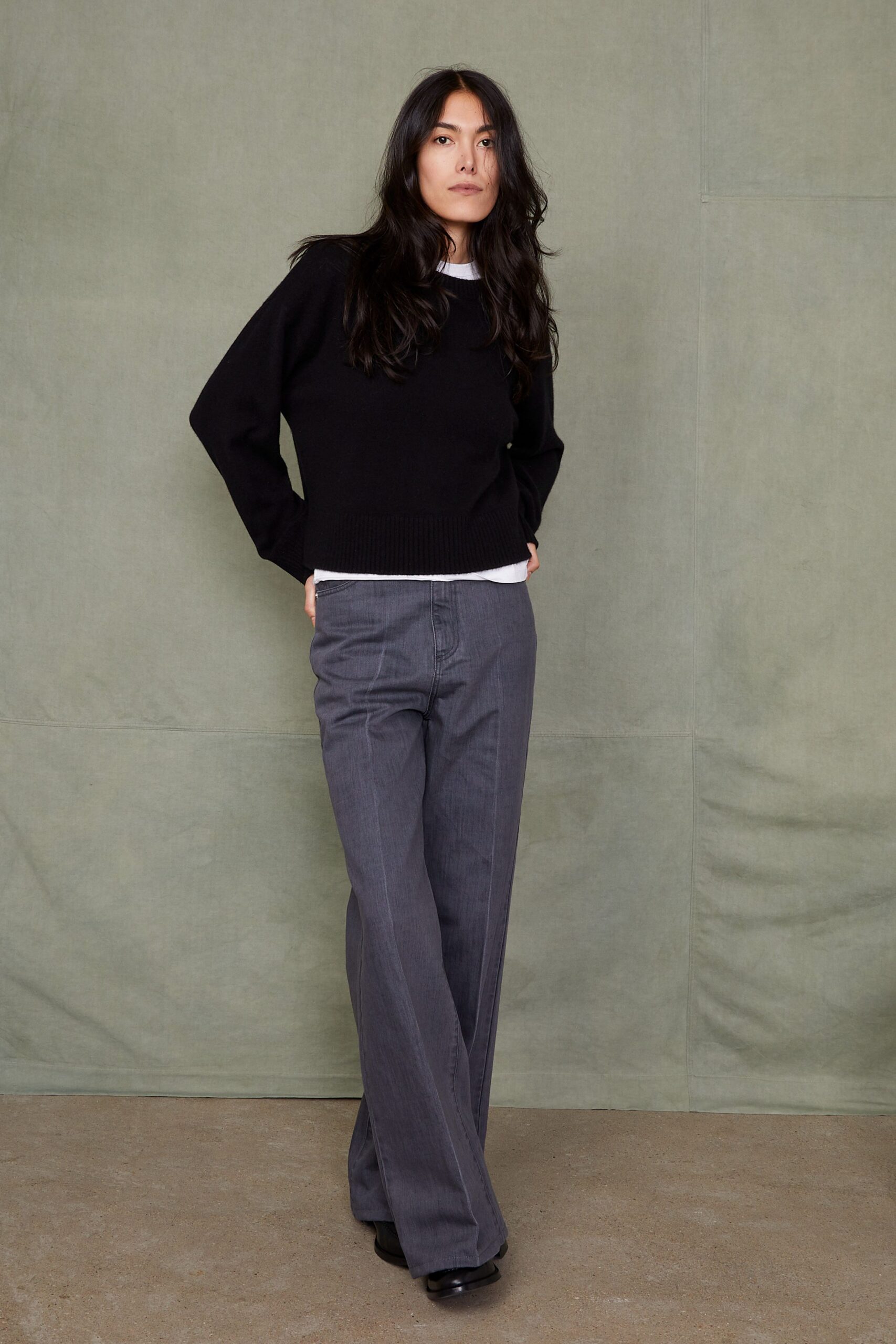black sweater gray wide-leg pants
