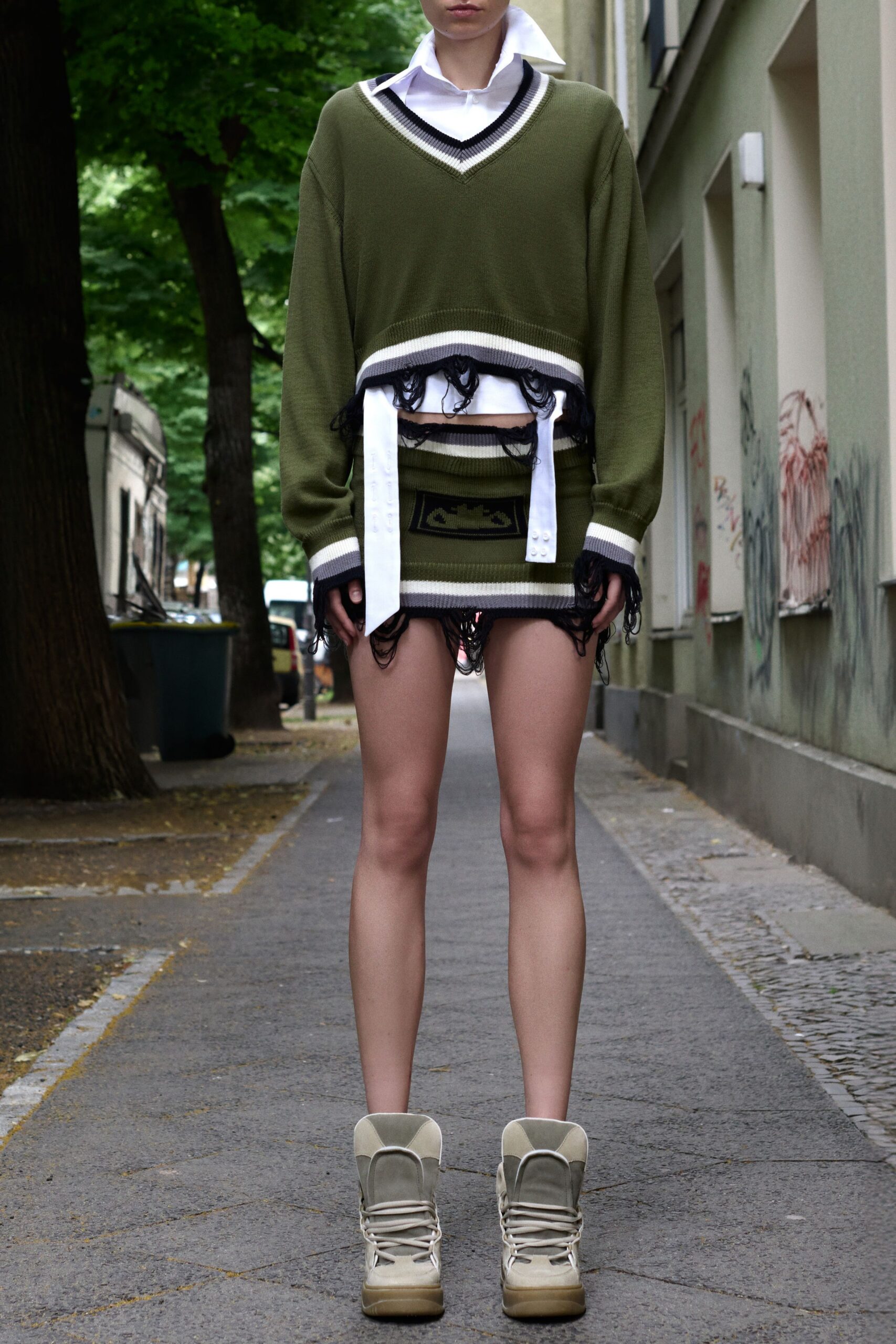 green relaxed sweater with mini skirt