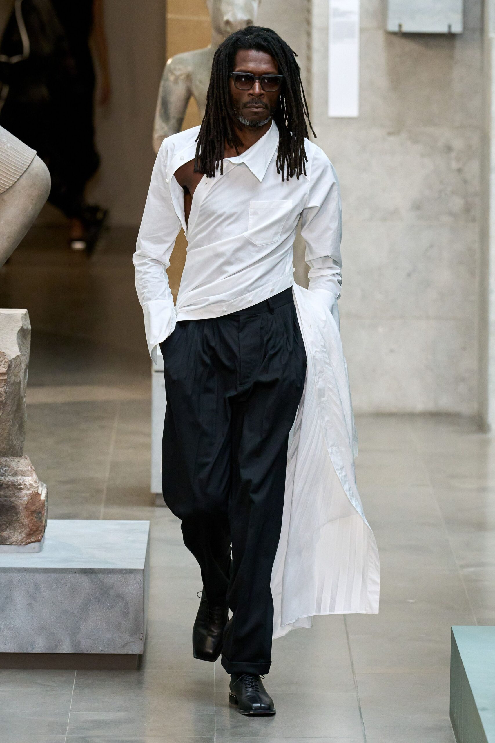 white asymmetric shirt black pants