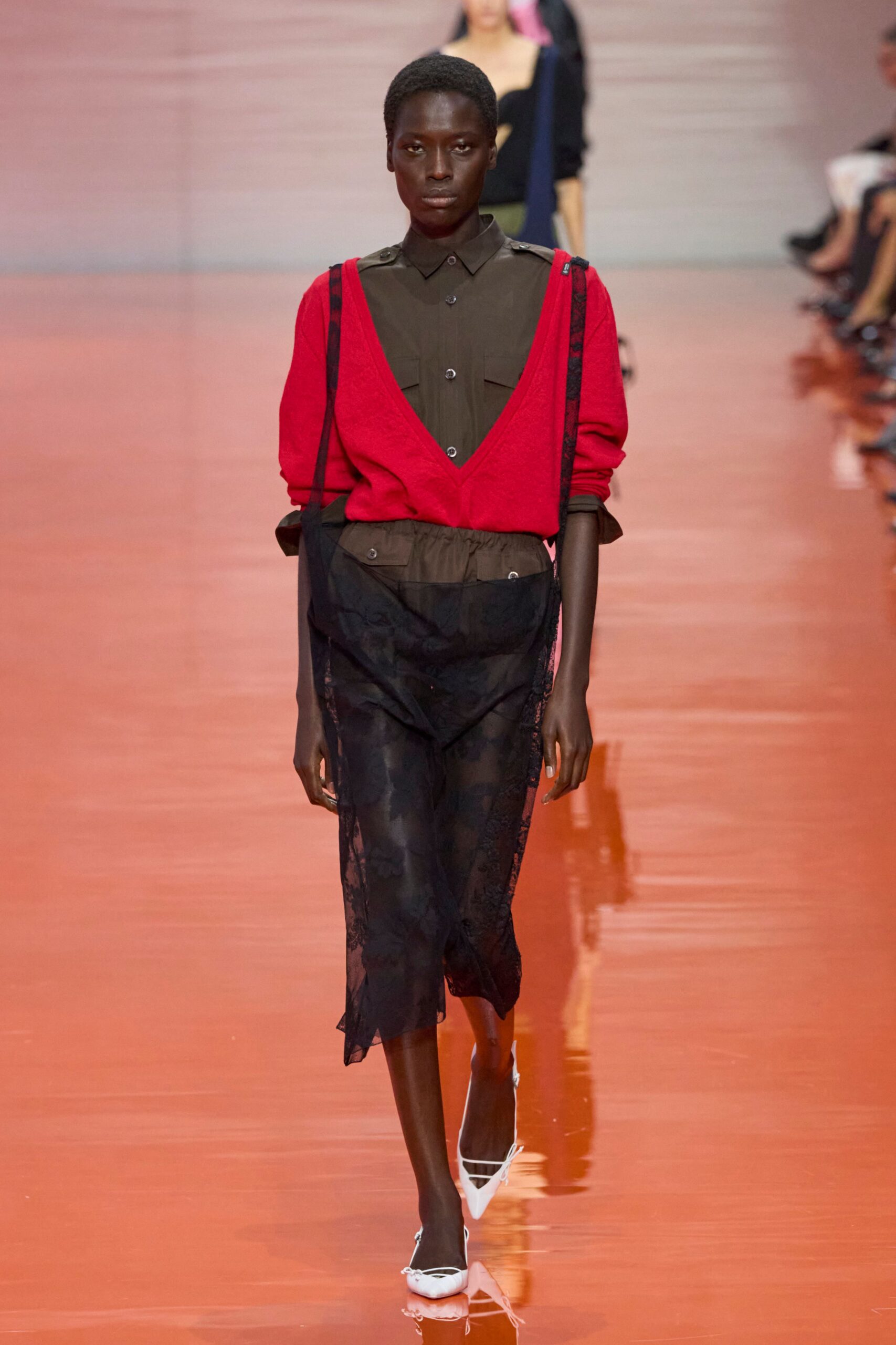 red top brown shirt black skirt white shoes