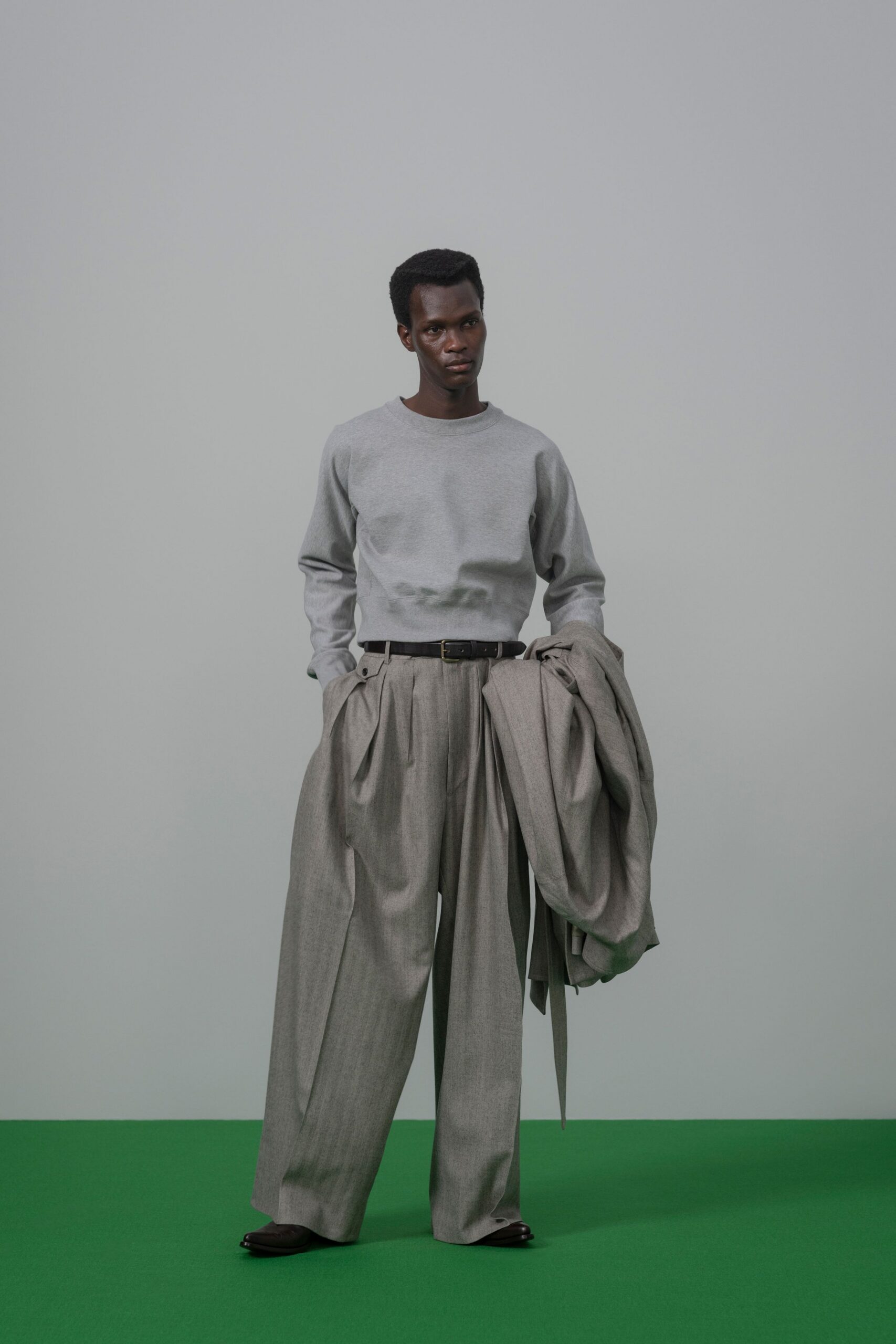 gray sweater beige pants jacket