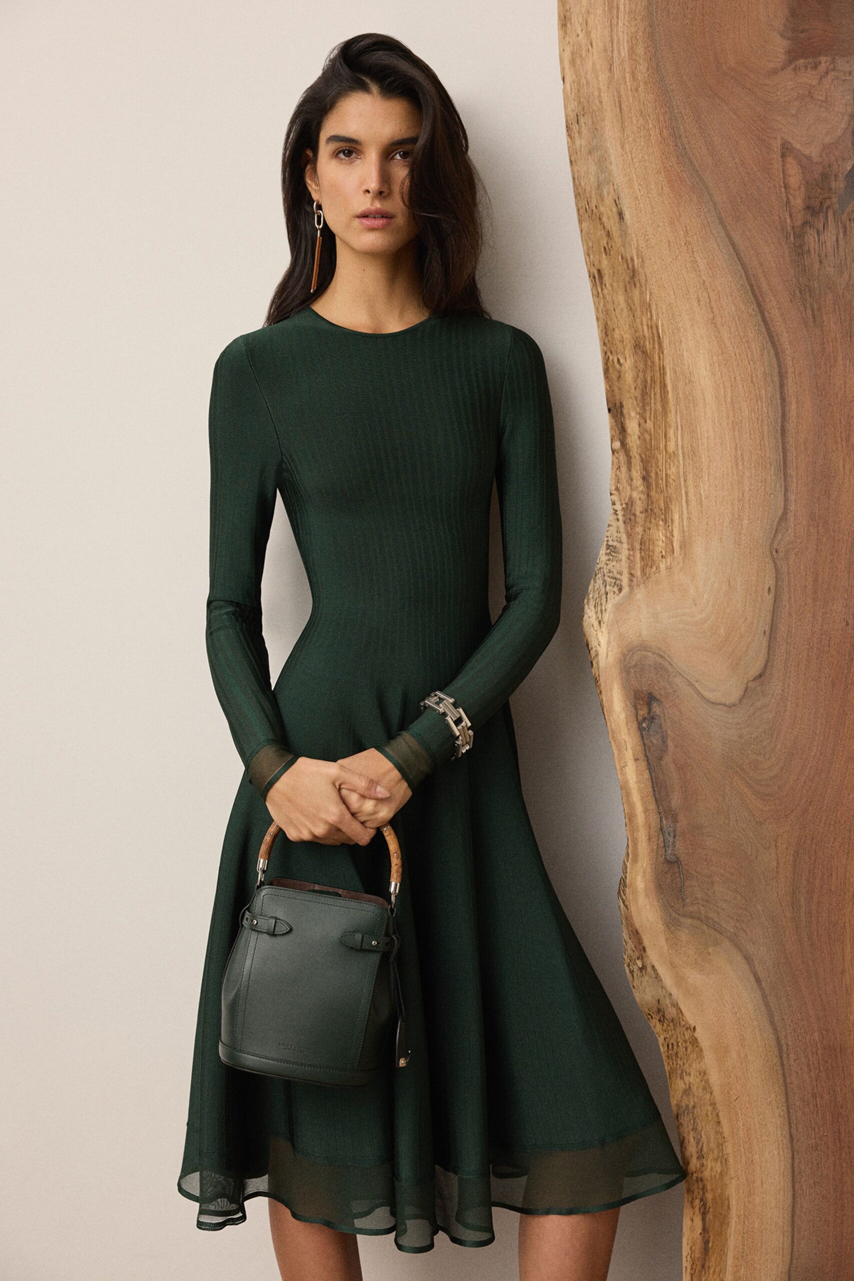 green cotton long-sleeve collared fitted pleated flowing dress