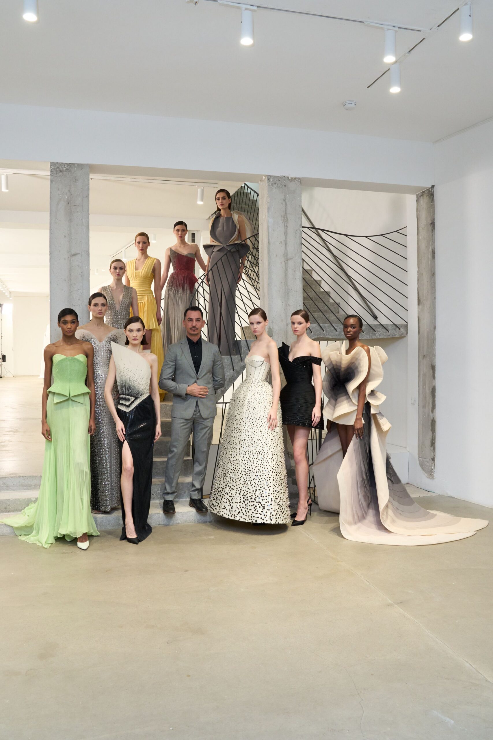 green silk sleeveless v-neck fitted pleated maxi gown