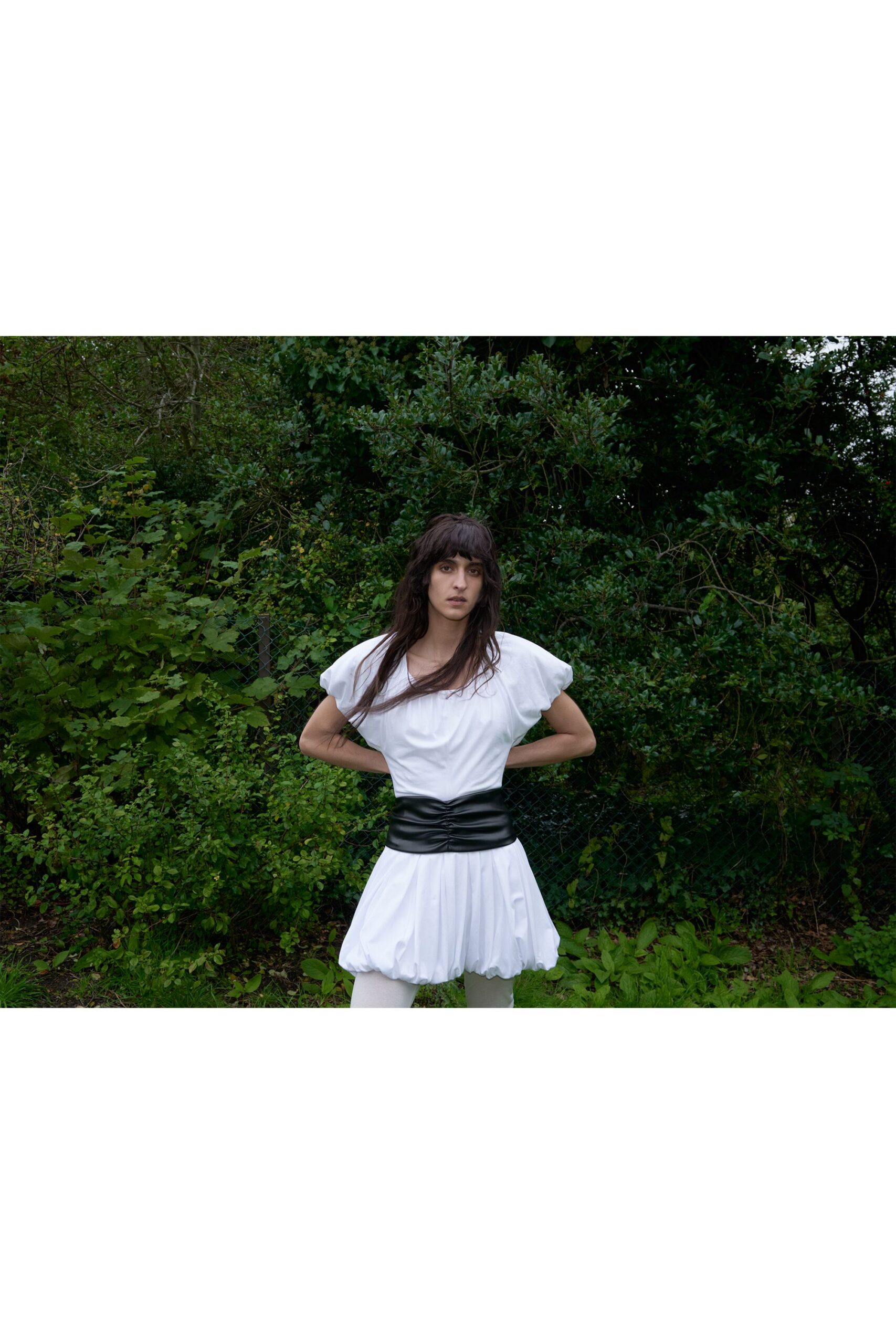 white ruffled mini dress with black belt