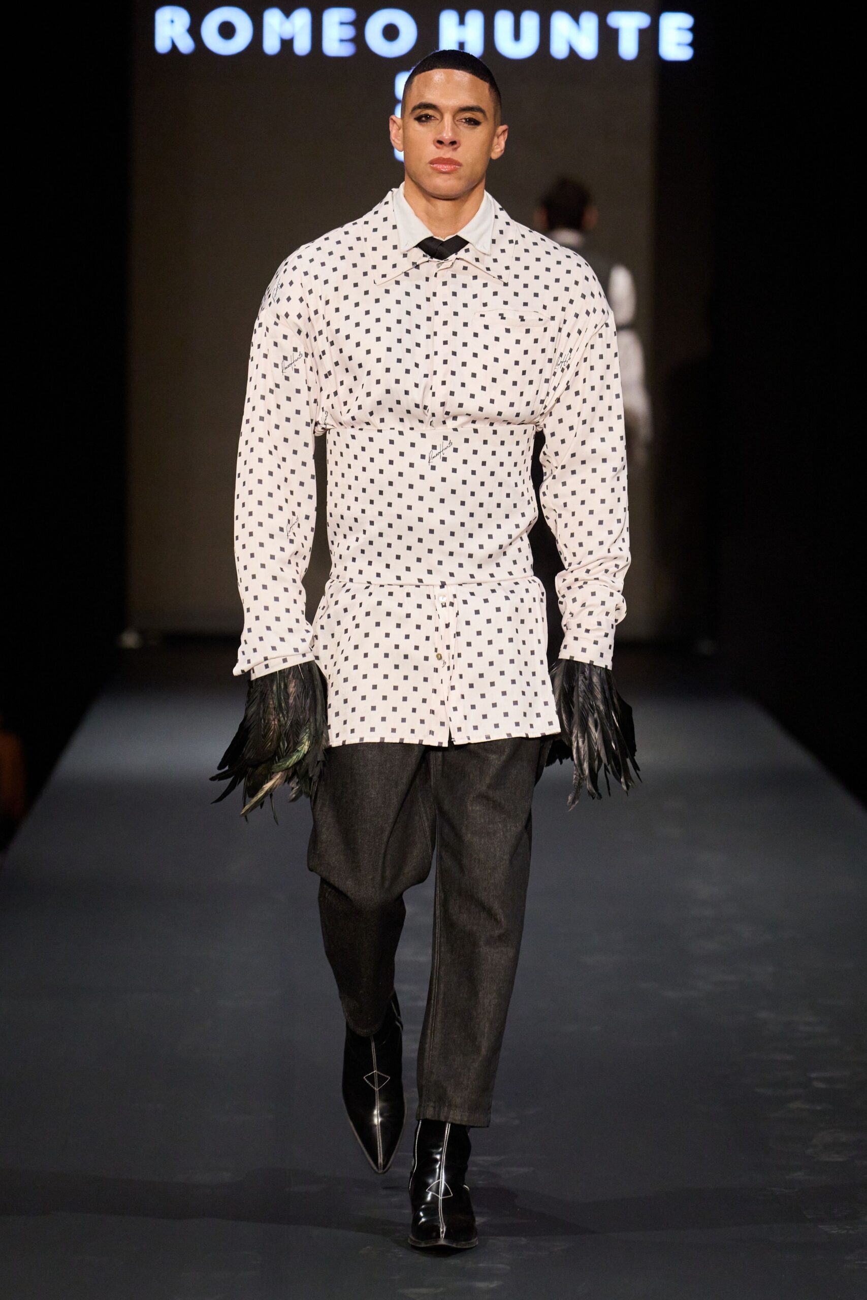white polka-dot shirt with gray pants