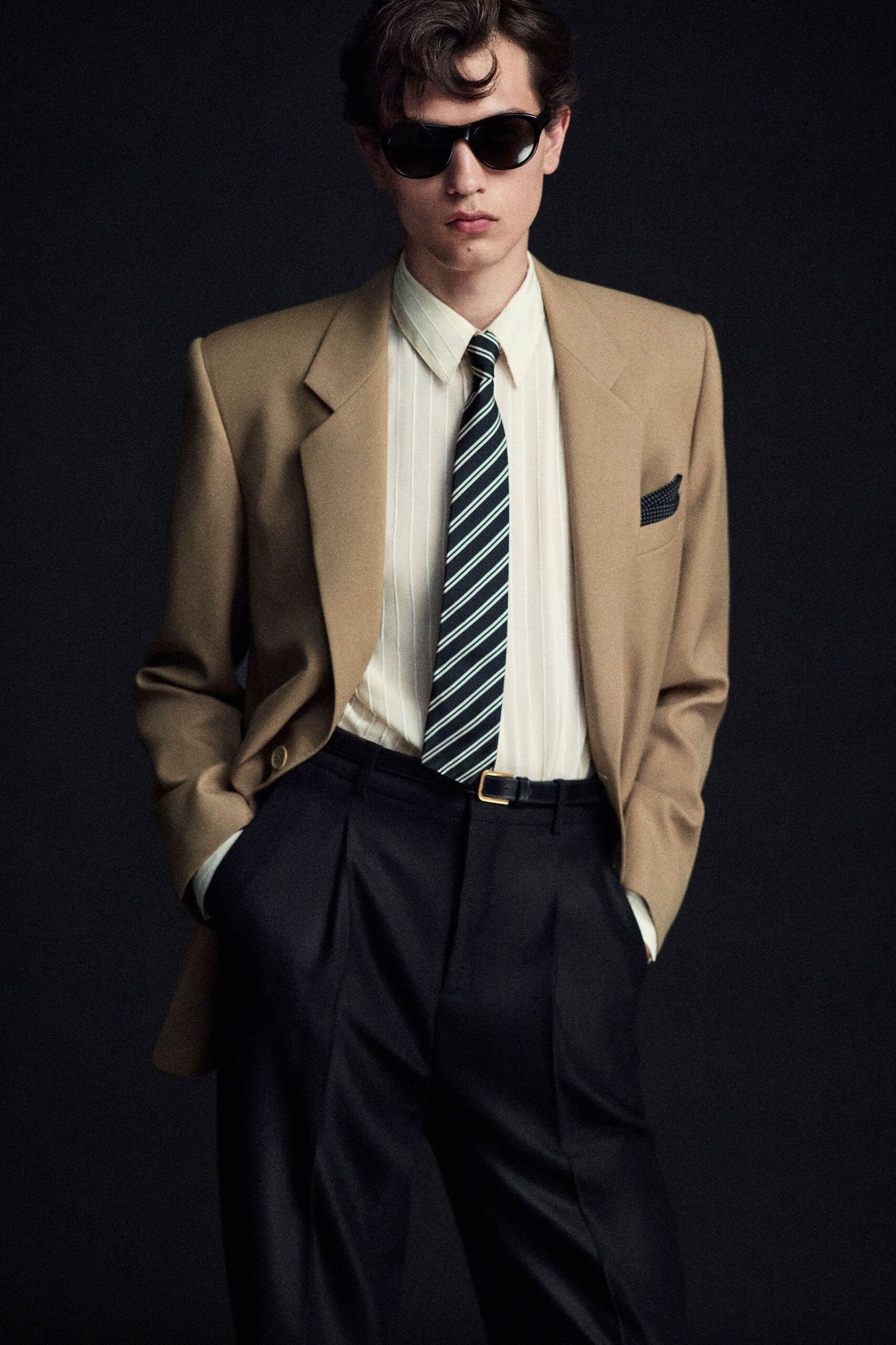 beige tailored blazer with black pants