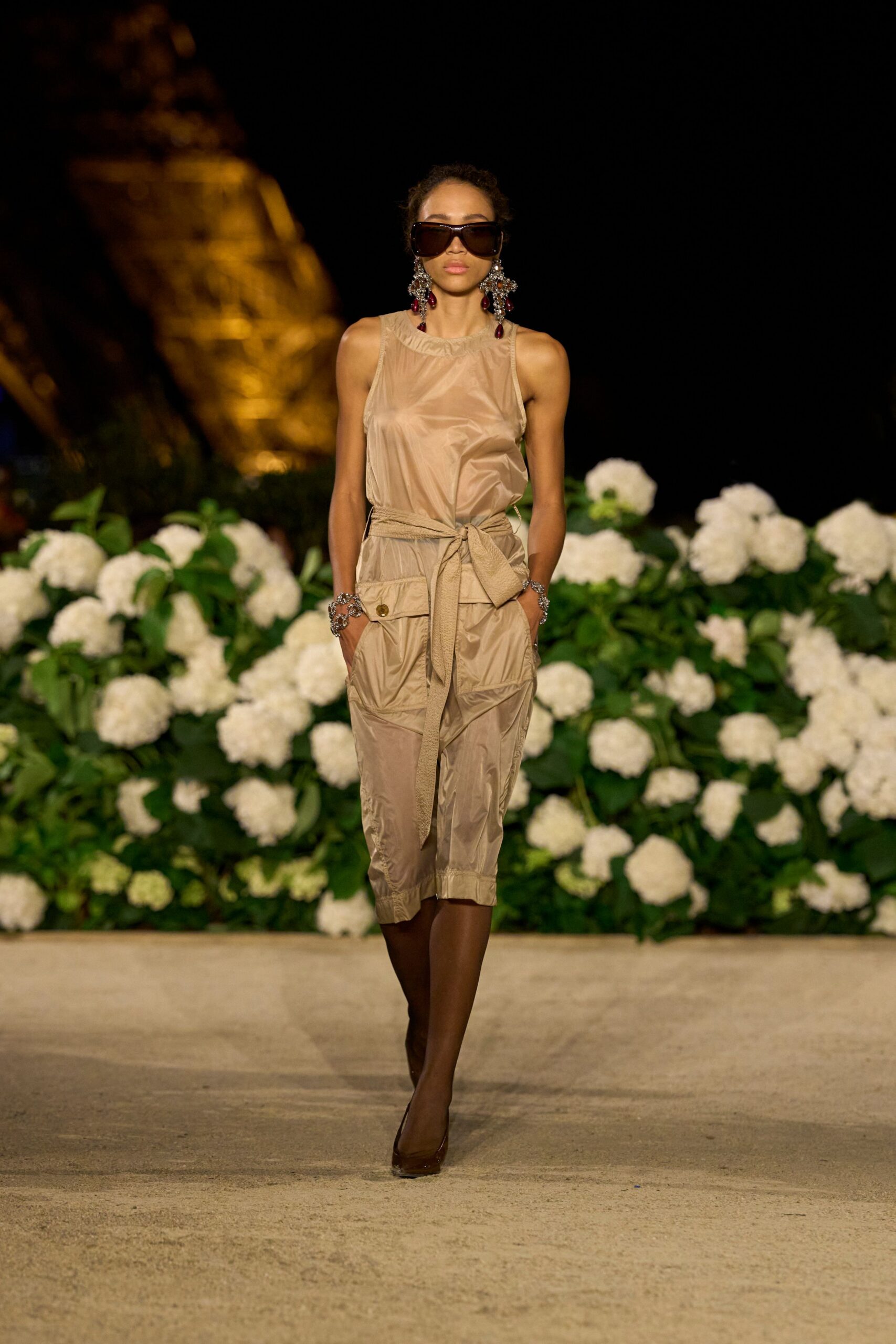 beige silk sleeveless high-neck fitted belted jumpsuit