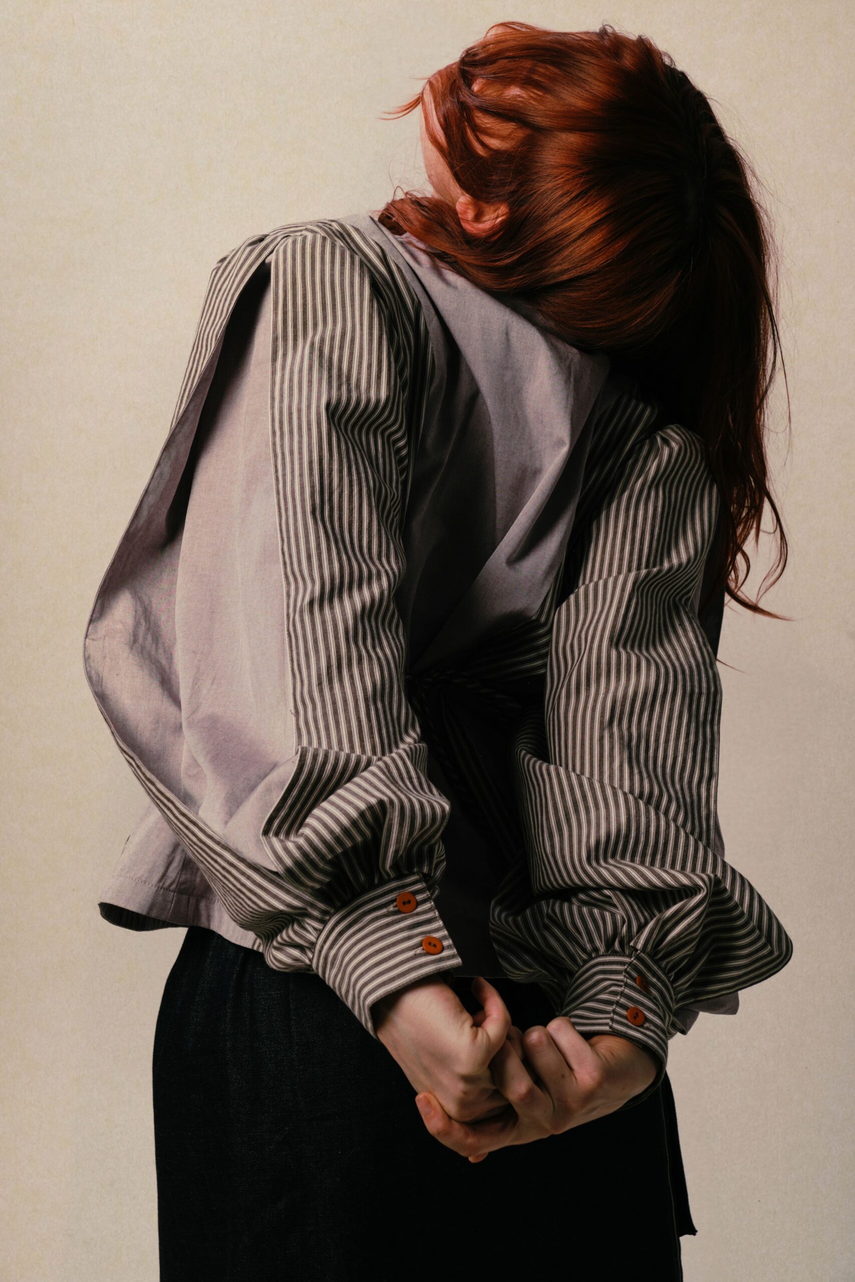 gray striped shirt with black pants