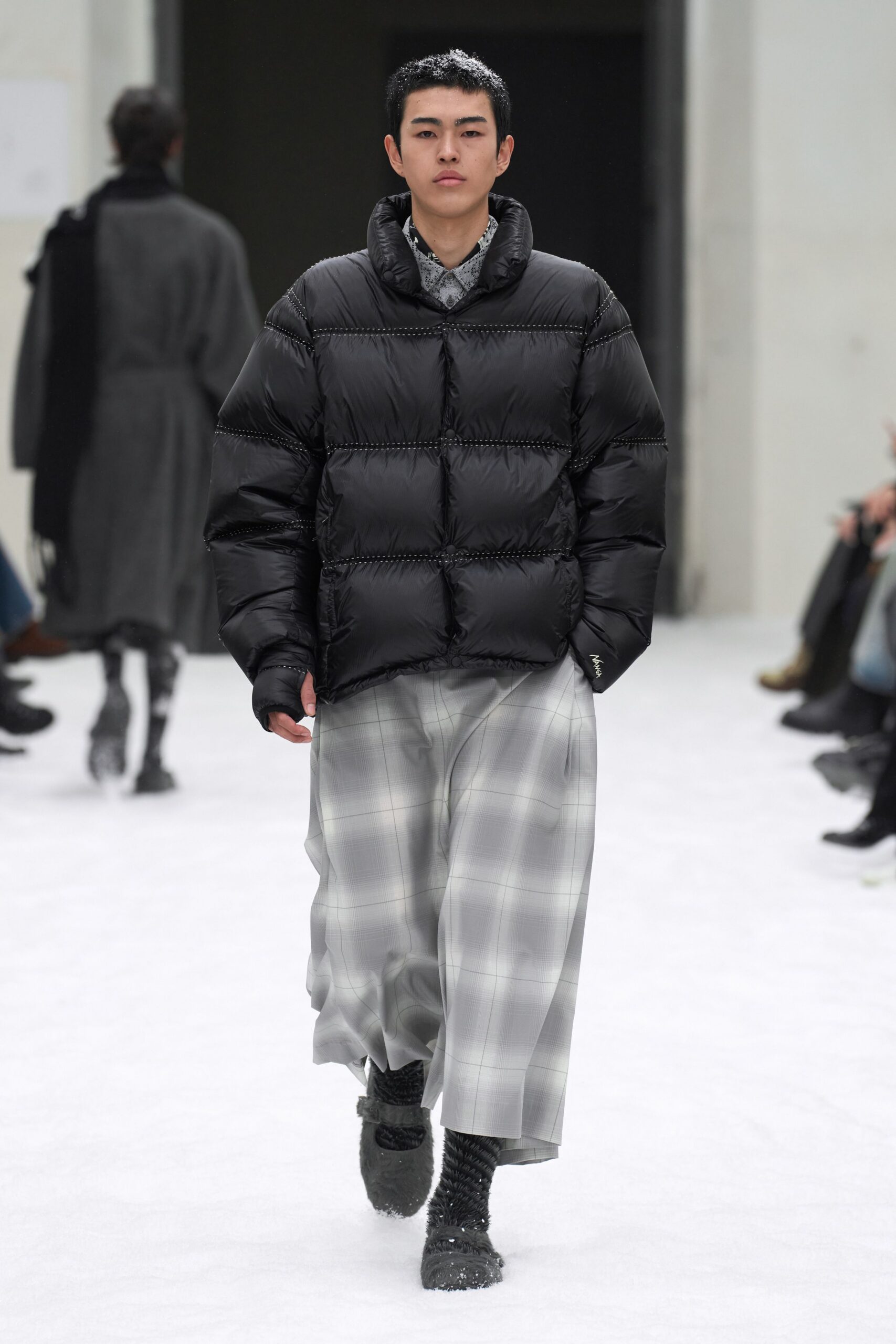 black padded jacket gray plaid pants