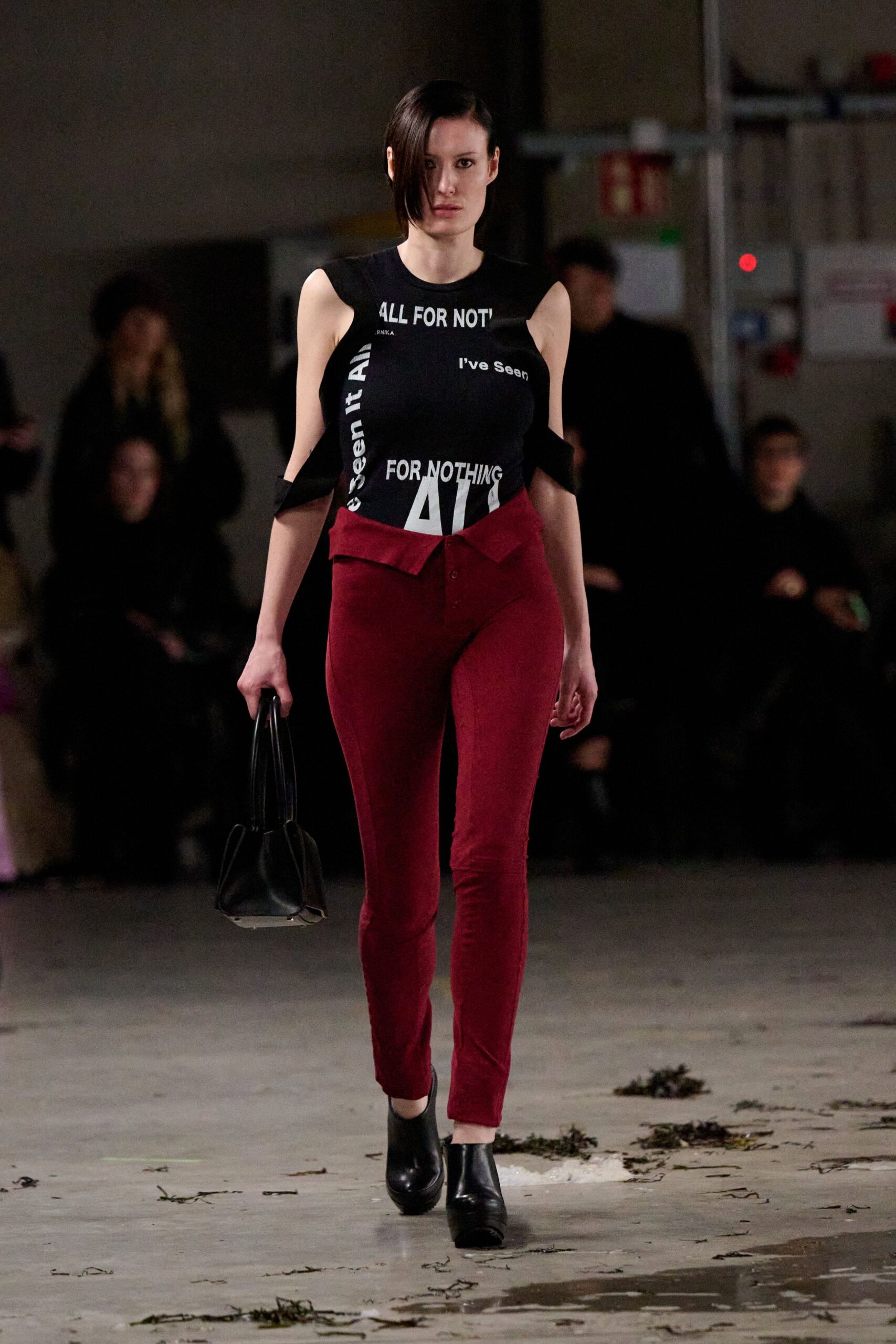 black printed sleeveless top with red pants