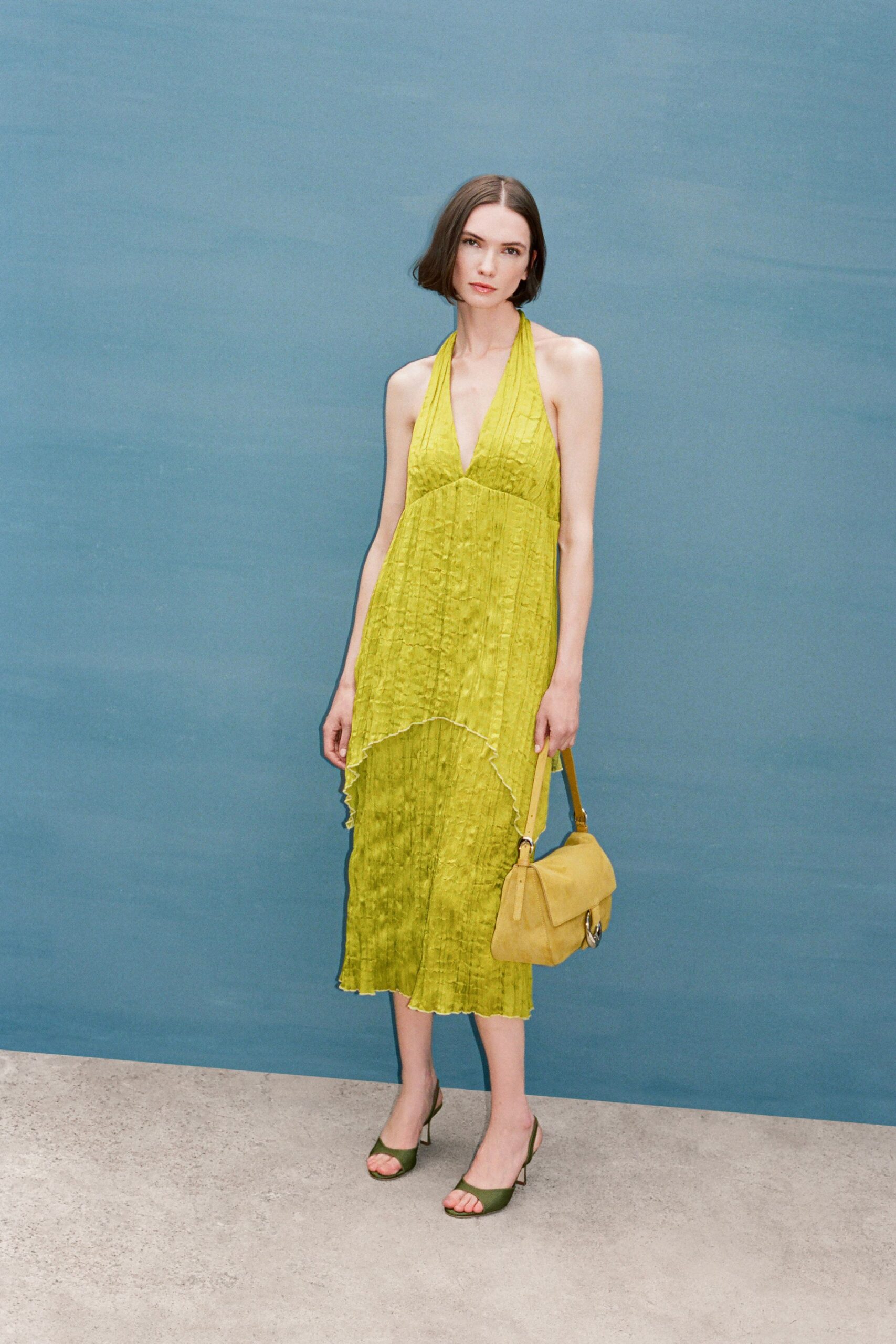green silk sleeveless v-neck fitted pleated draped dress