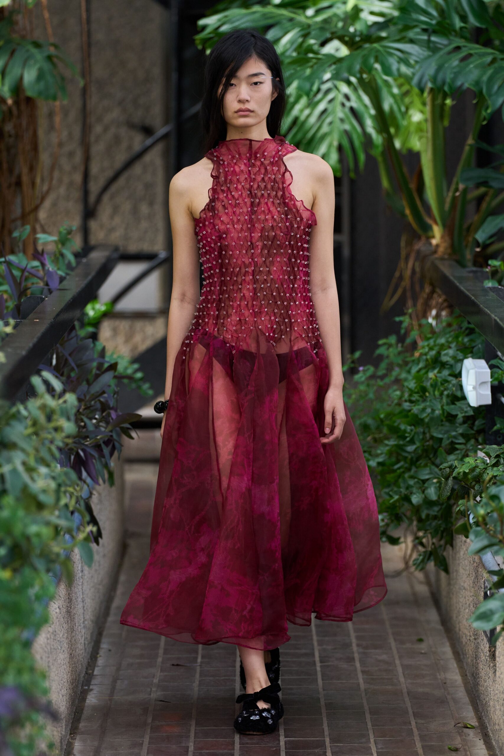 red silk sleeveless high-neck fitted pleated embroidered gown