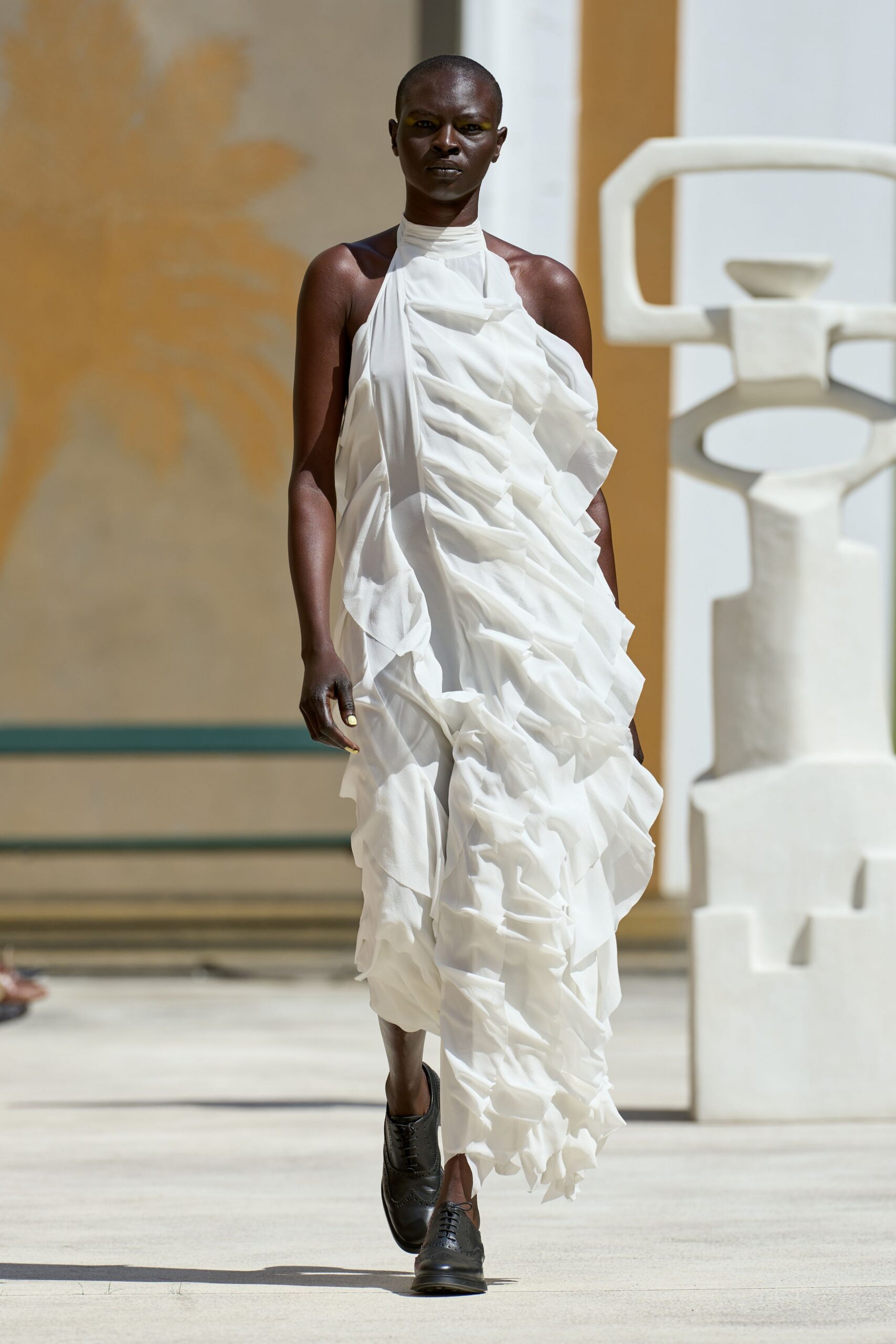 white silk sleeveless high-neck relaxed ruffled flowing dress