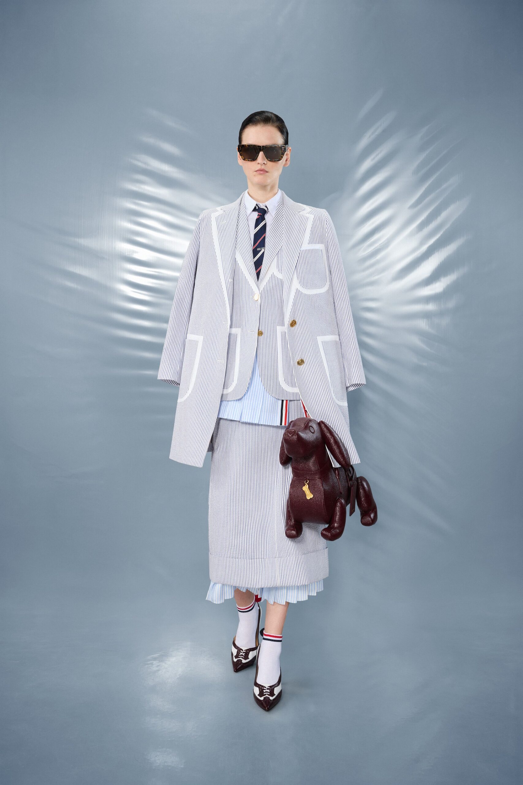 tailored blazer with pleated skirt