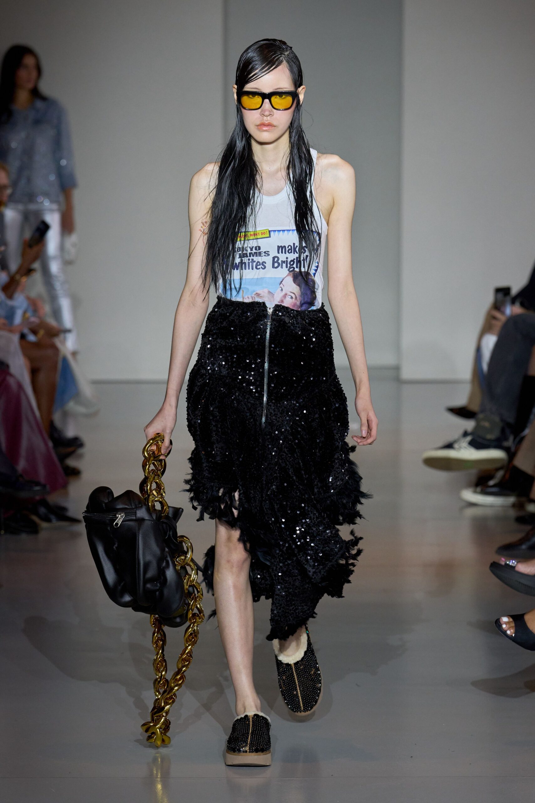 white sleeveless top with black sequin skirt