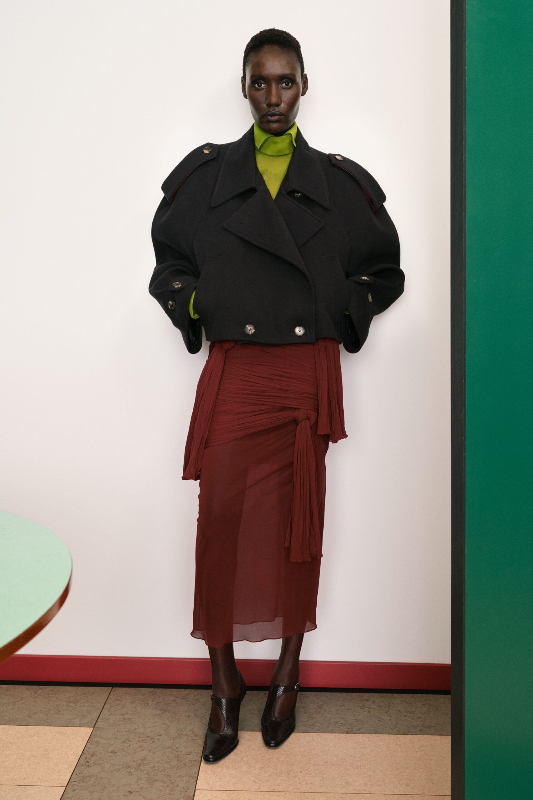 black oversized coat with red skirt