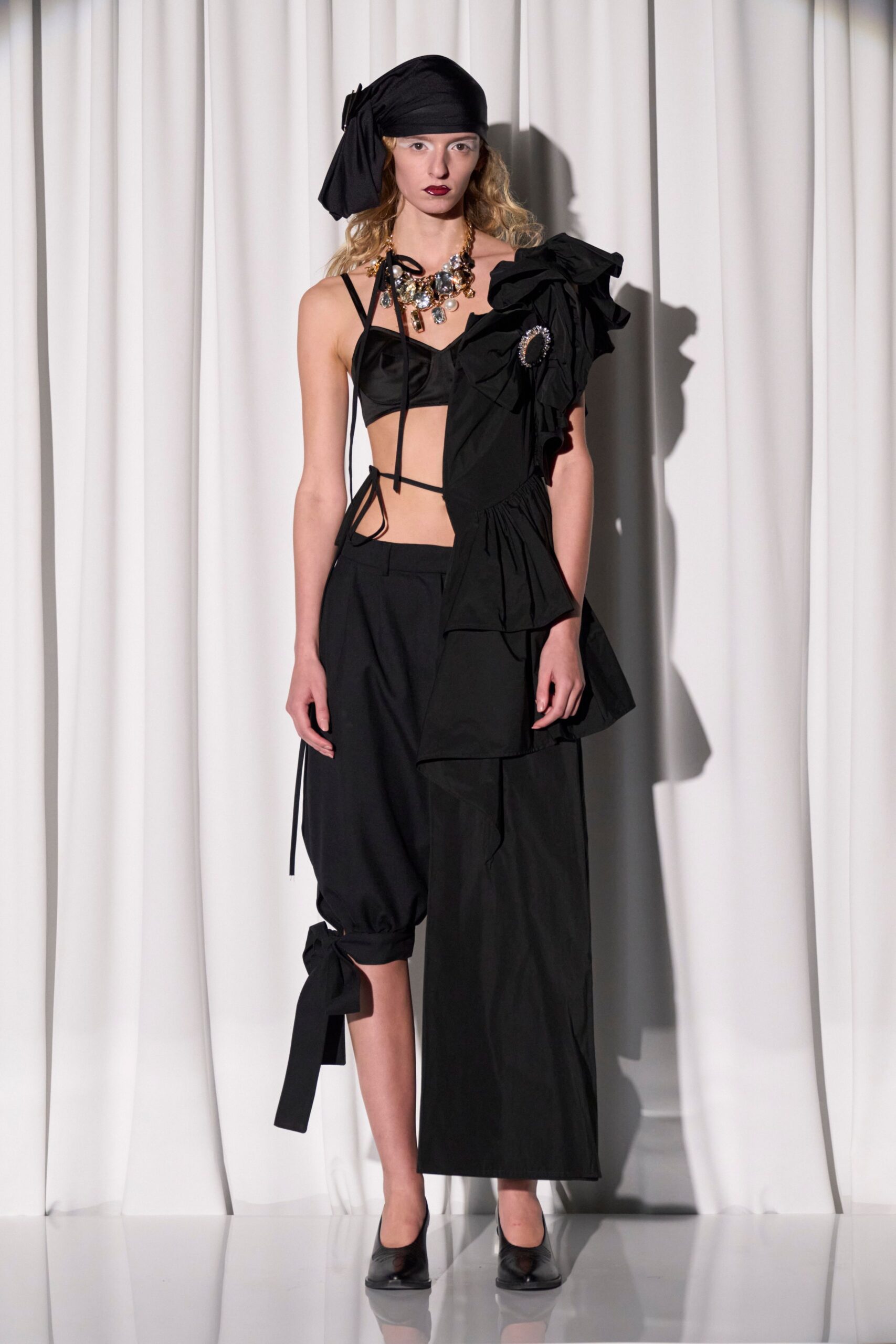black silk top with pleated pants