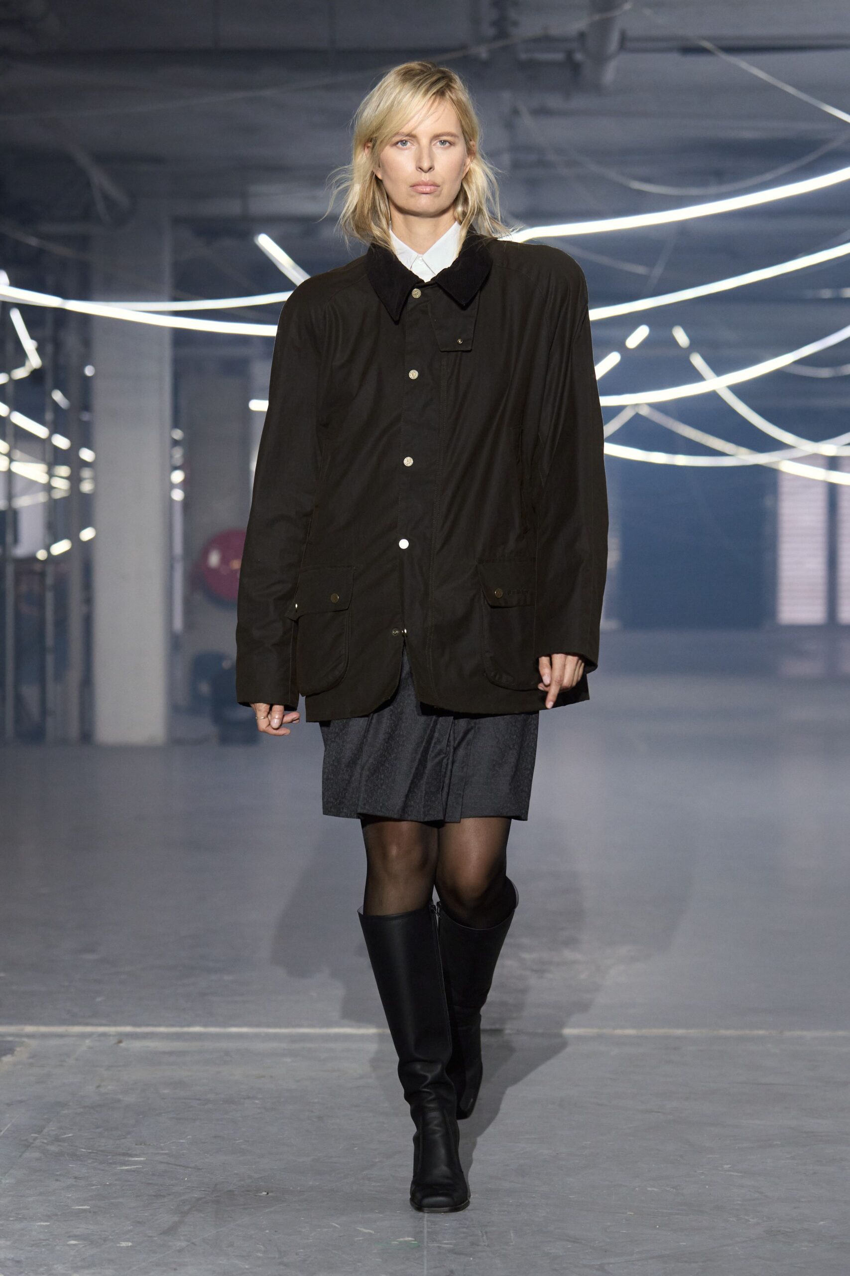 black relaxed jacket gray pleated skirt