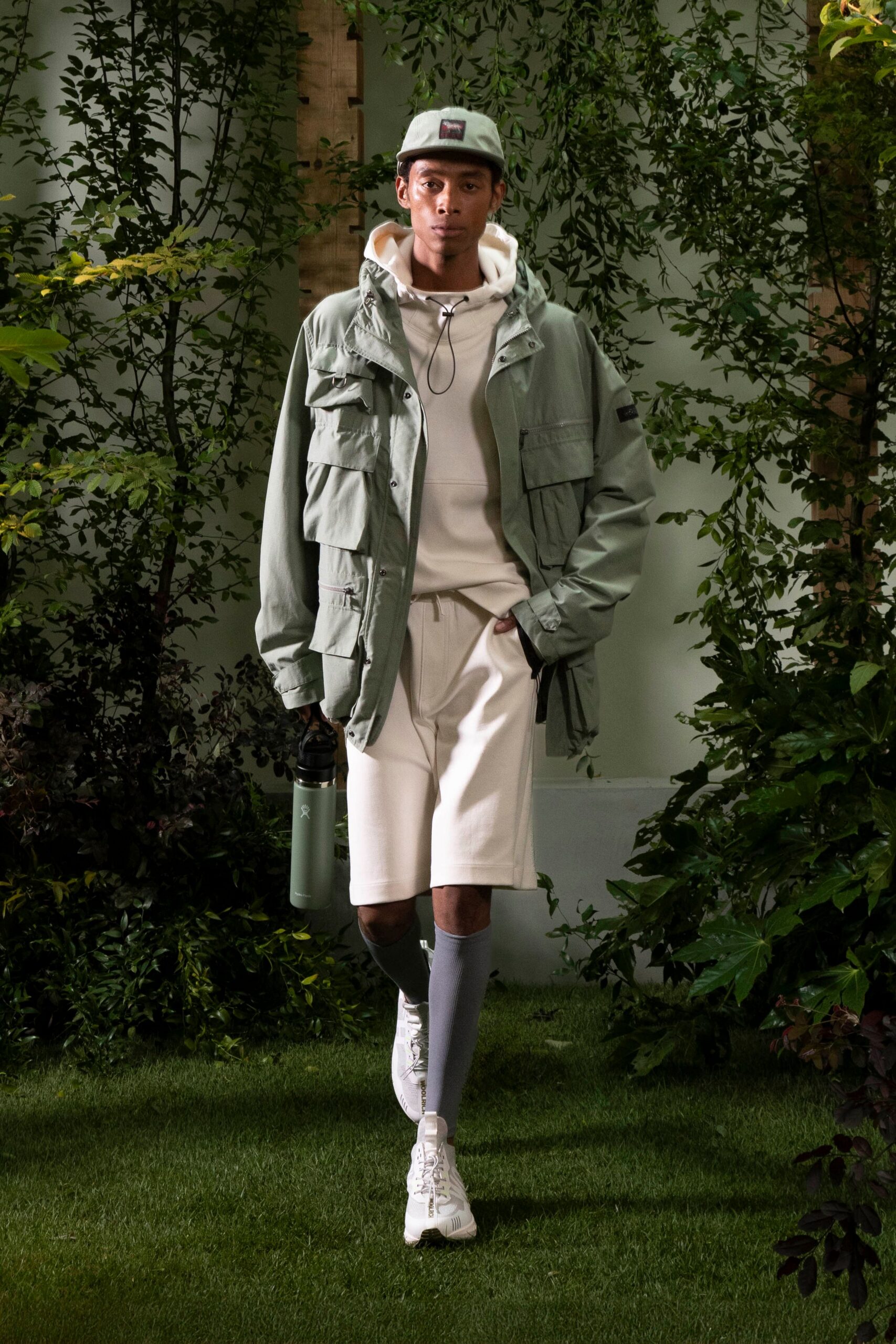 green jacket white hoodie shorts