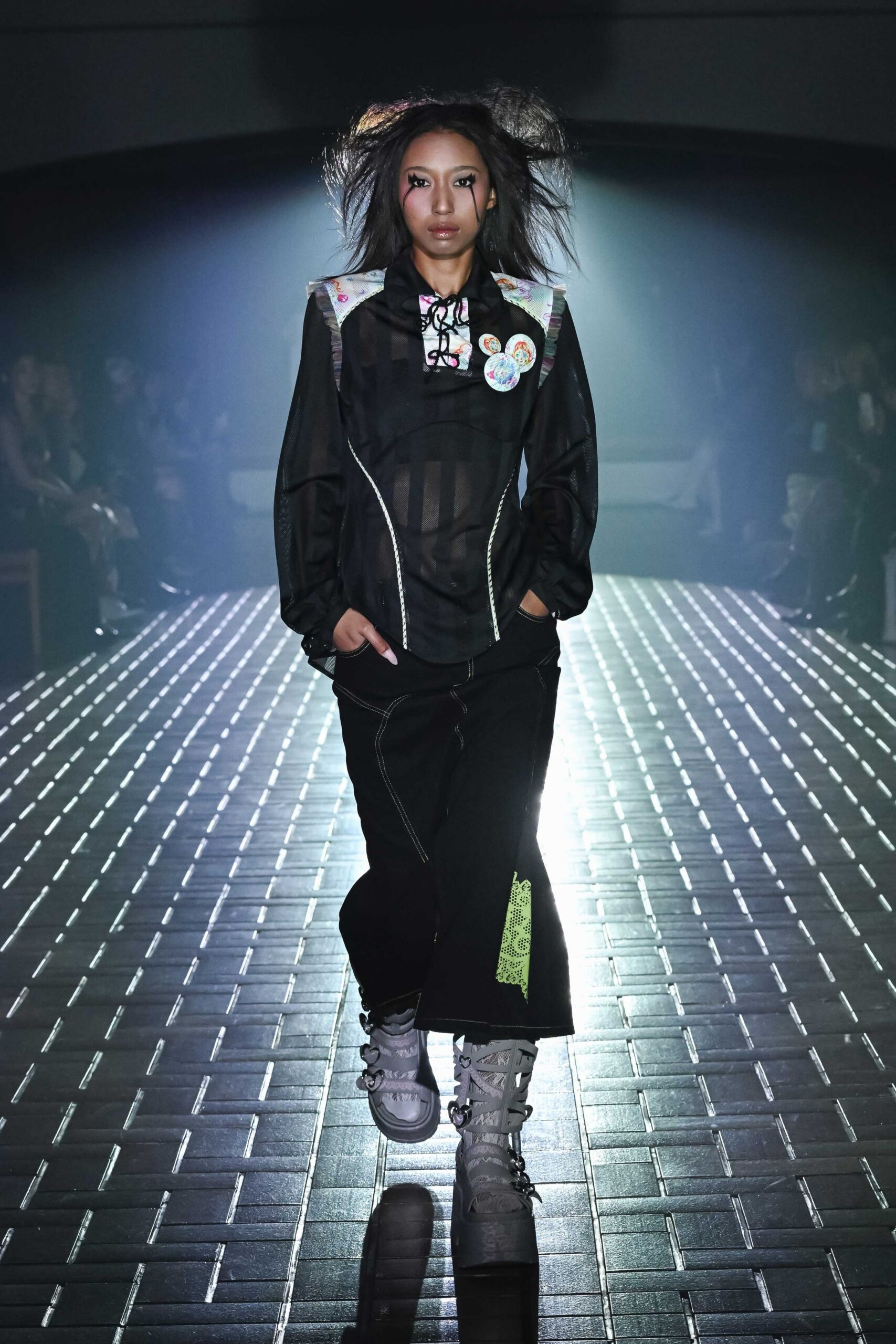 black mesh shirt with wide-leg pants