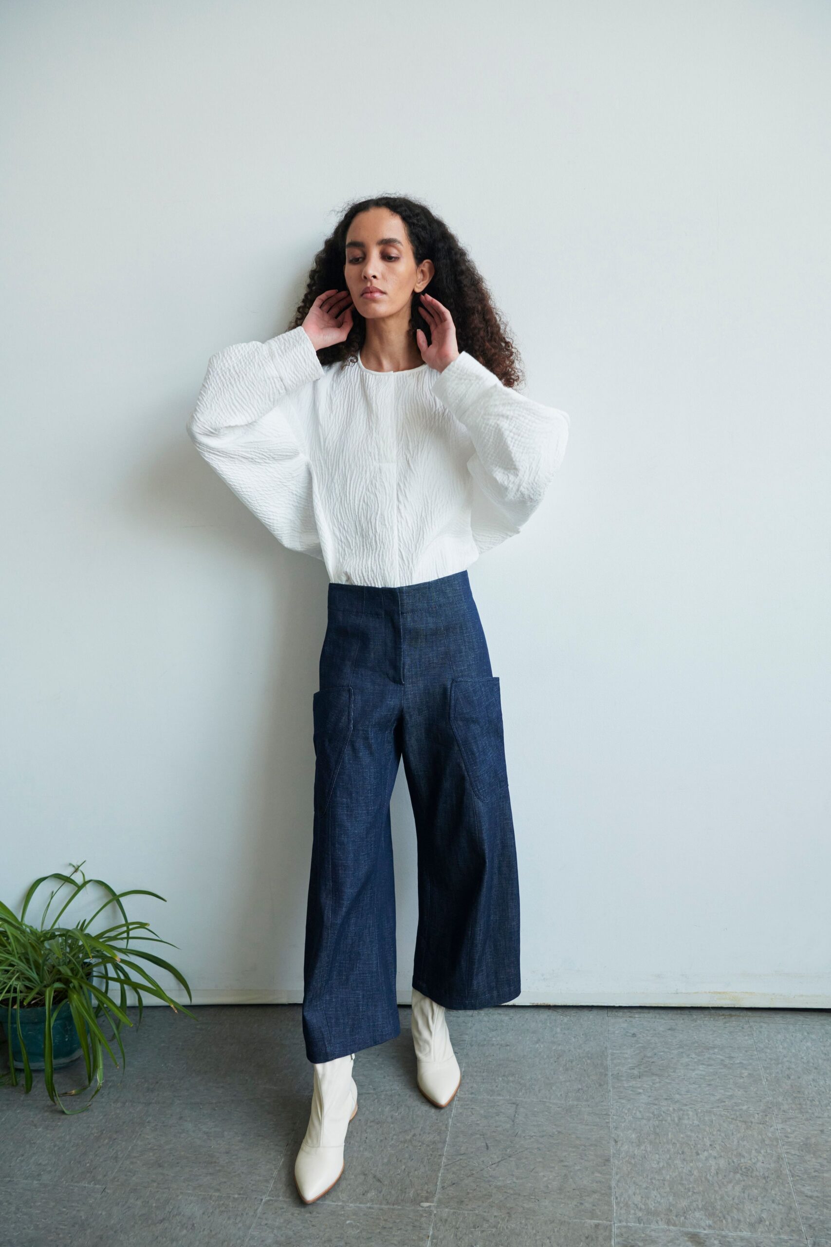 white relaxed top with blue wide-leg pants