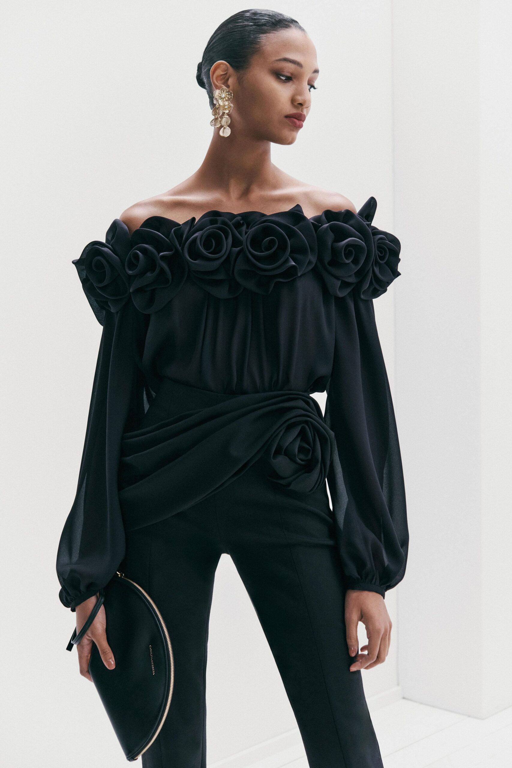 black off-shoulder top with ruffles