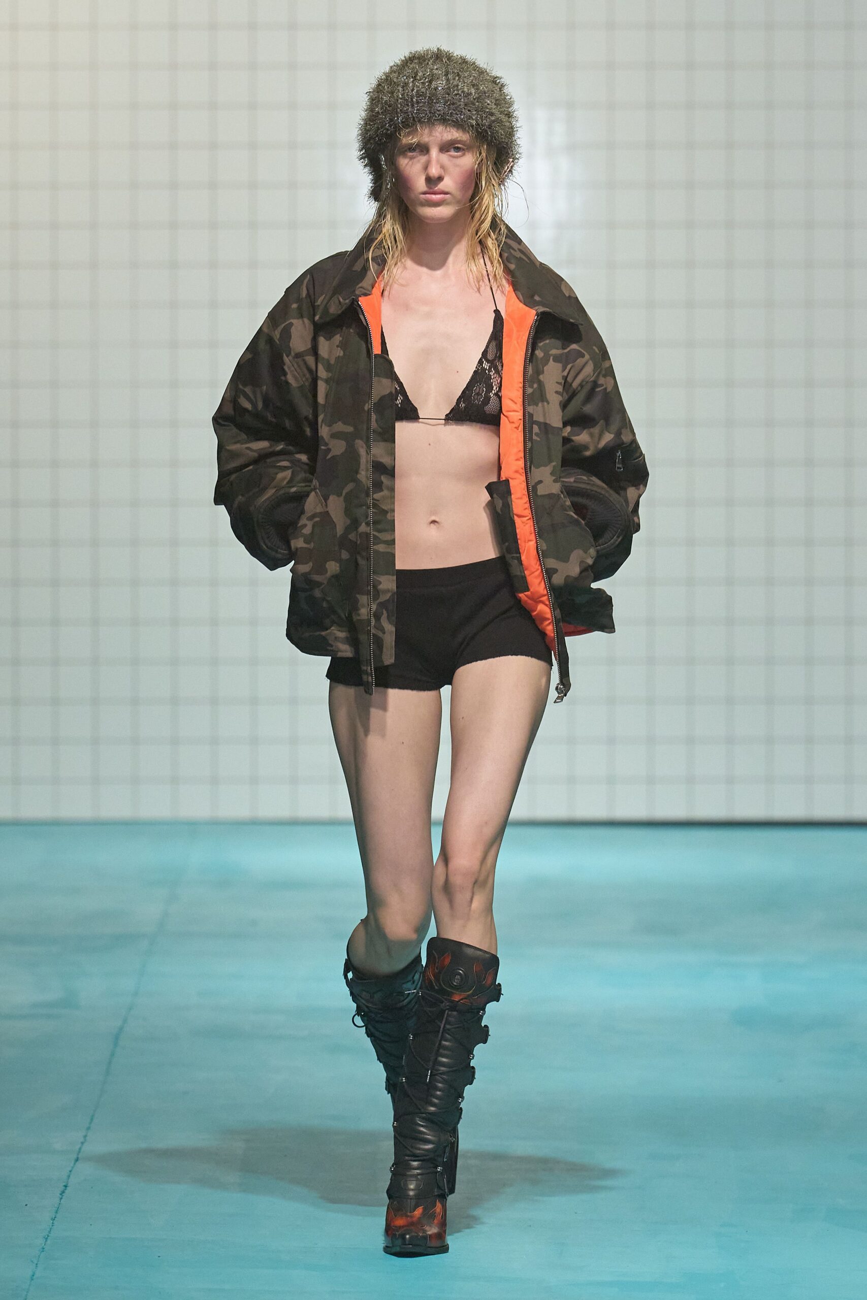 camouflage jacket with black shorts