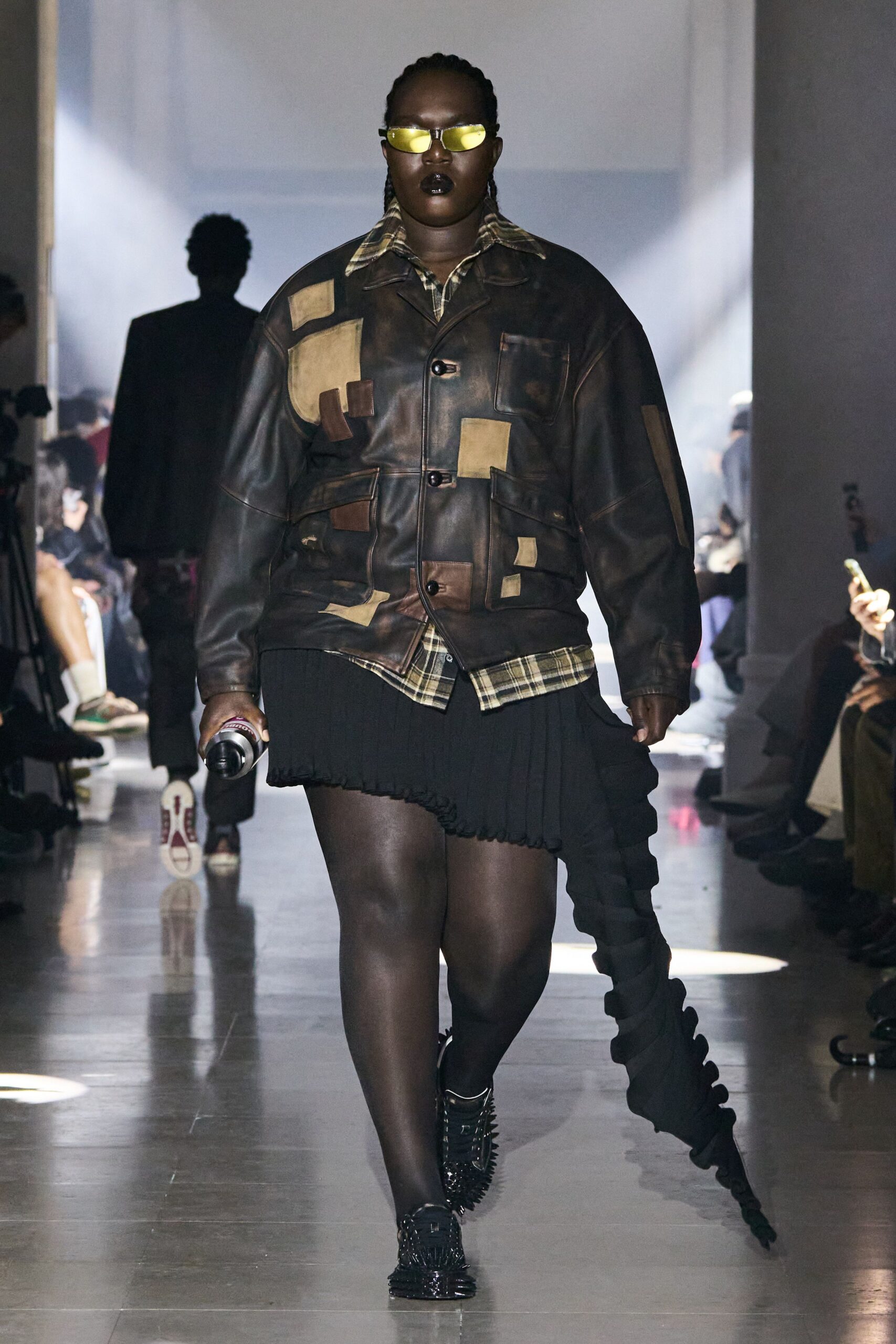 brown leather jacket with pleated skirt