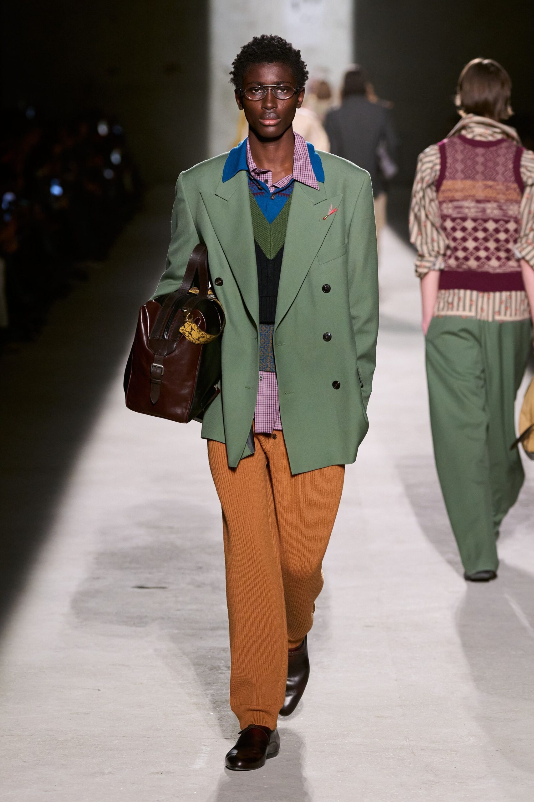 green tailored blazer with orange pants