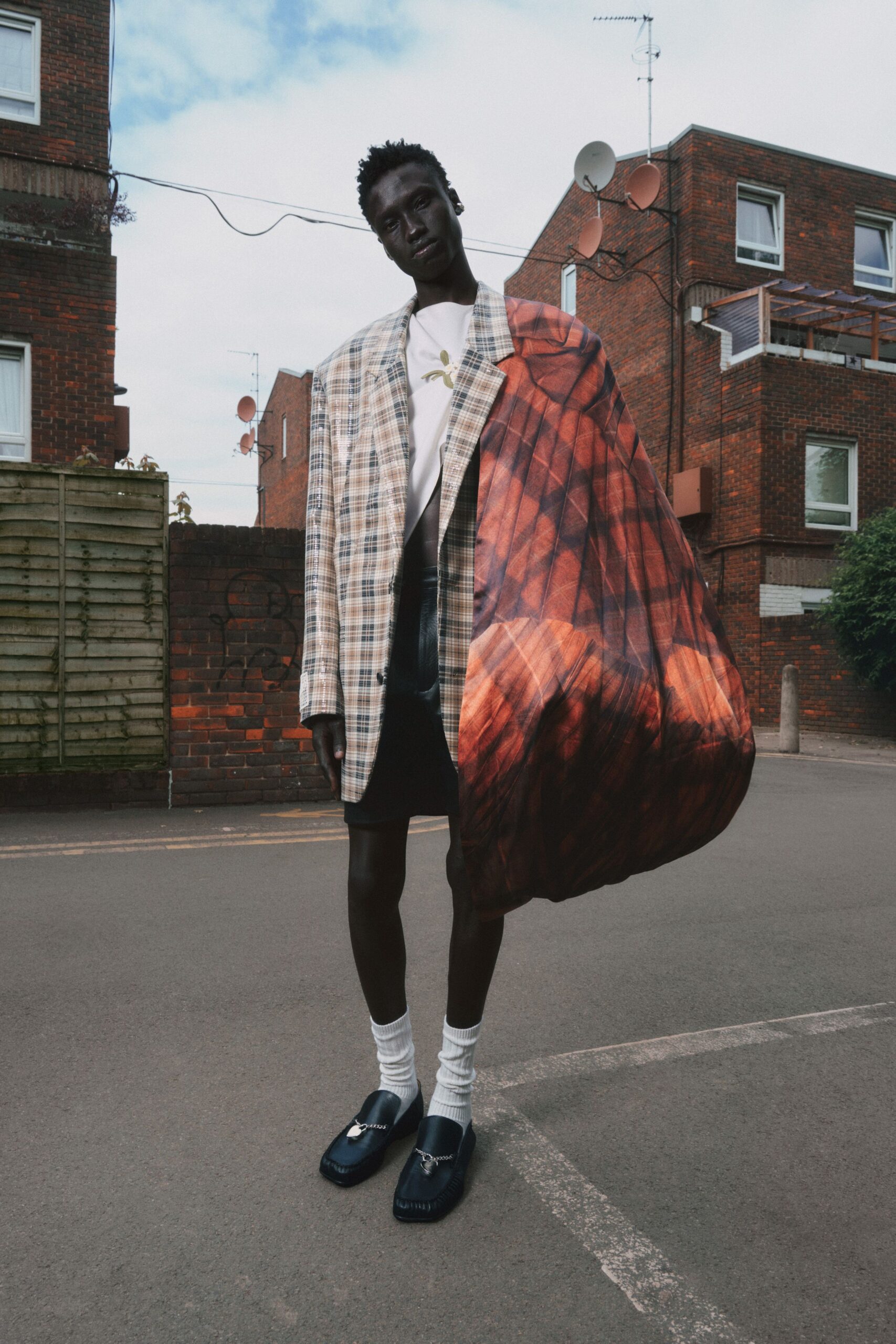 beige checked blazer with black skirt