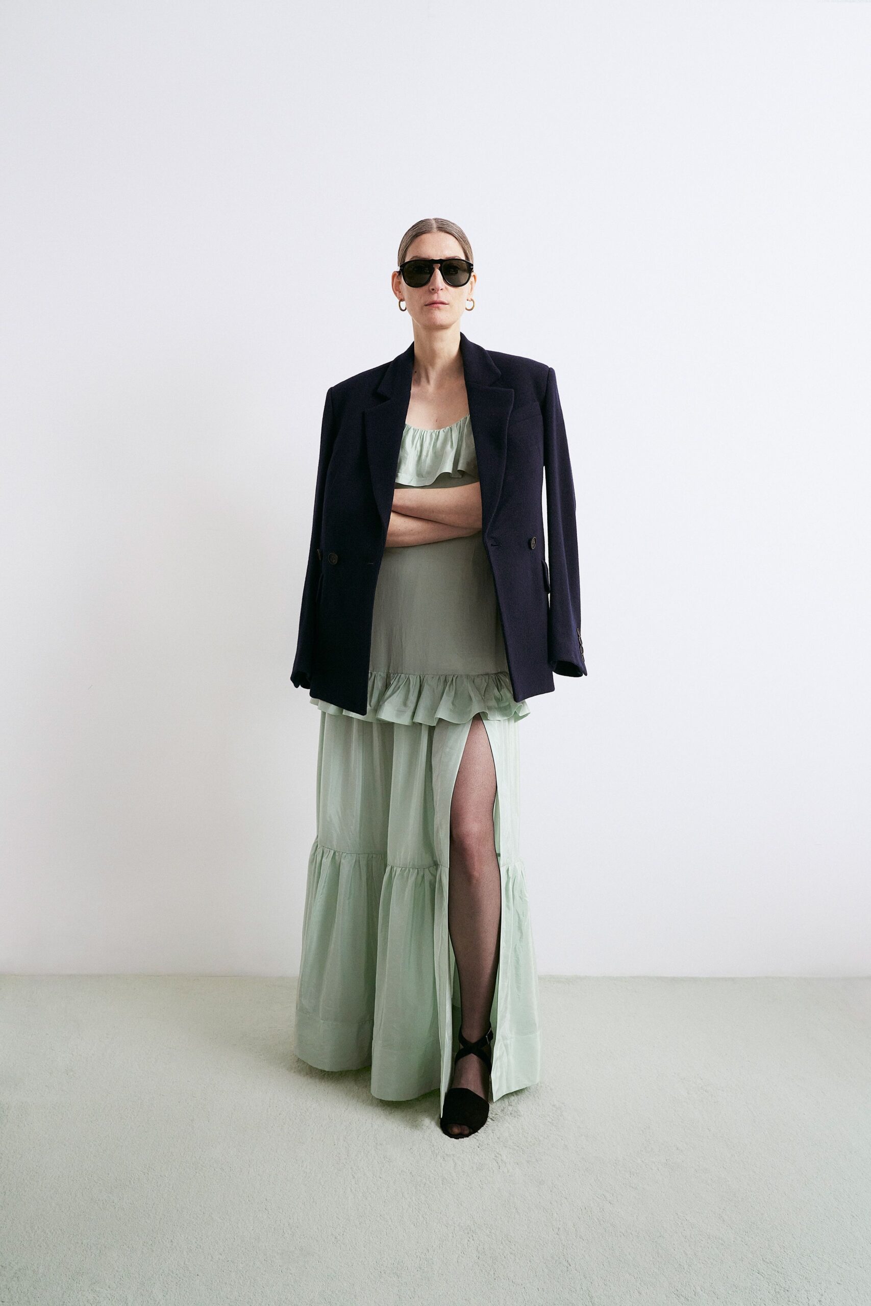 green cotton sleeveless v-neck fitted ruffled tiered gown