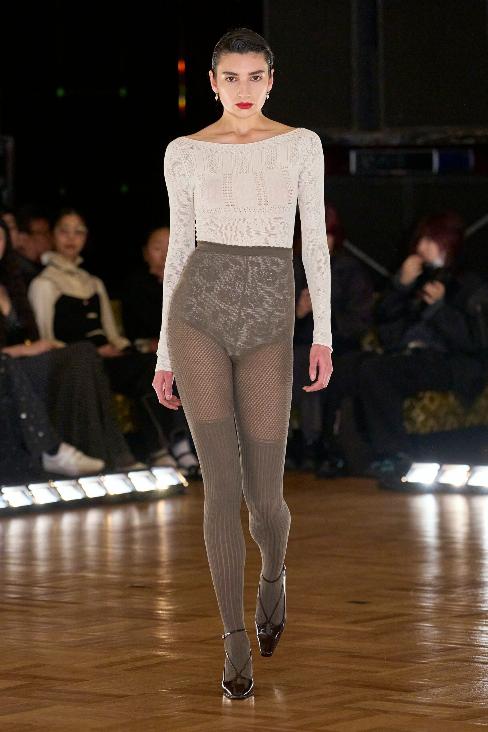 white off-shoulder top with gray pants