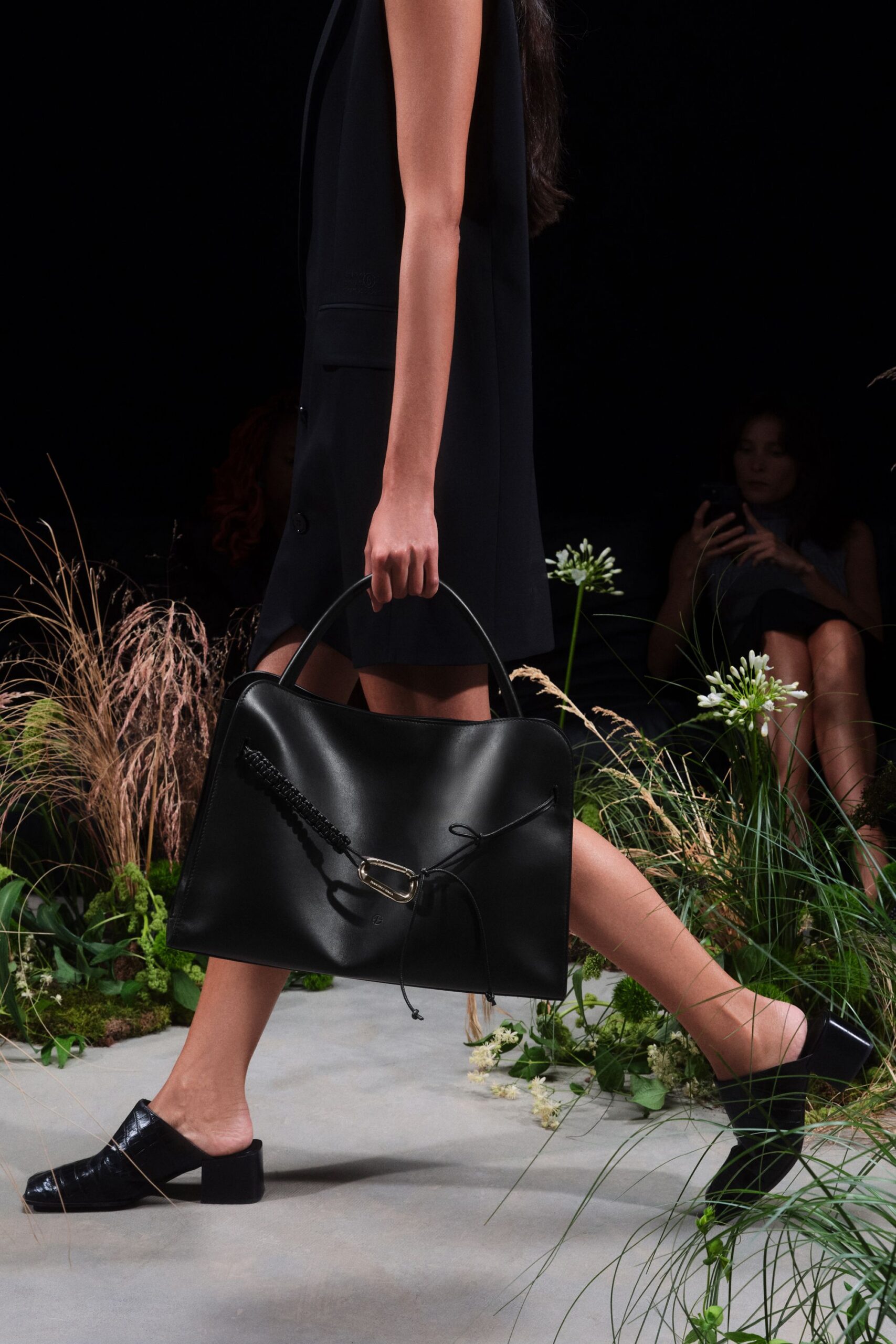 black fitted sleeveless dress with bag