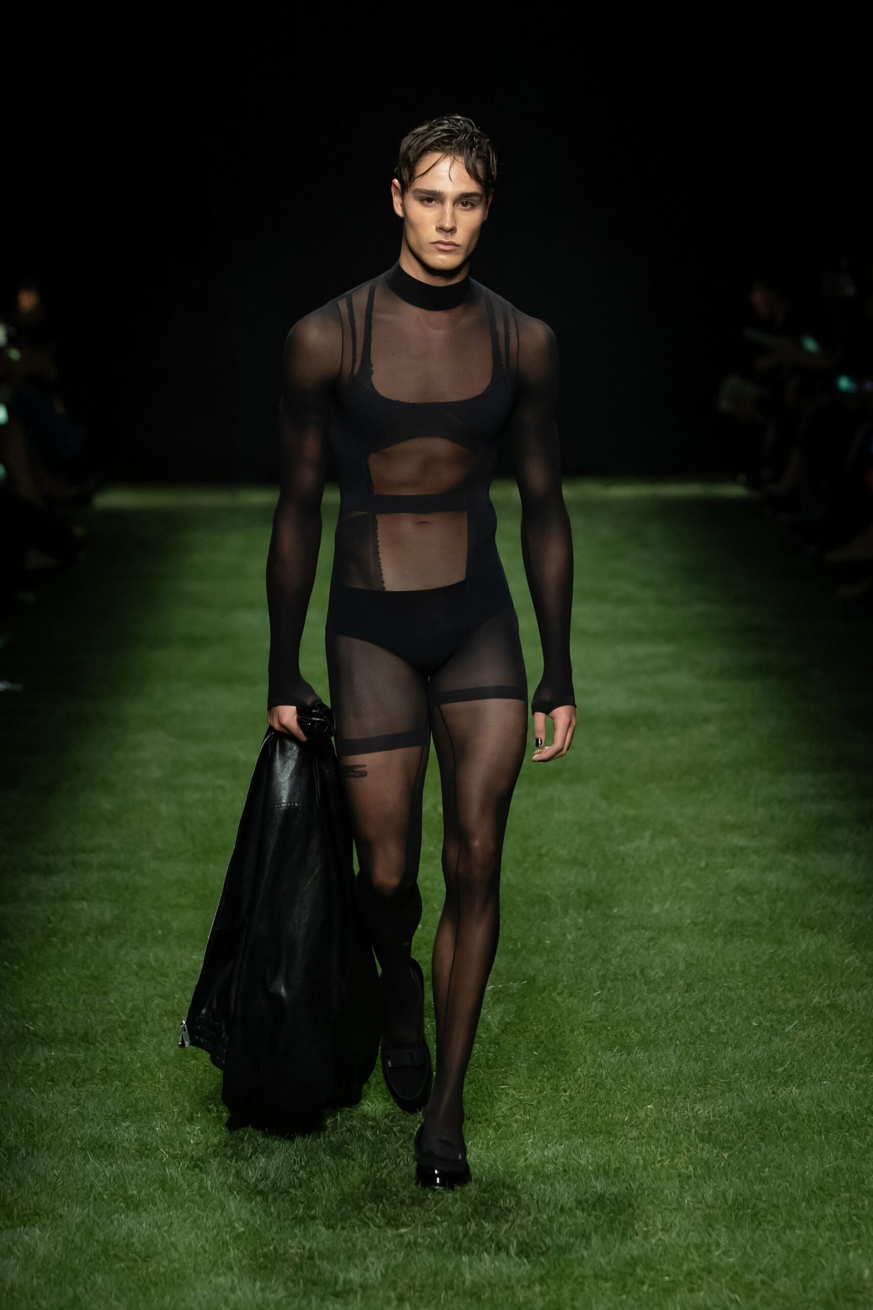 black mesh bodysuit with leather coat