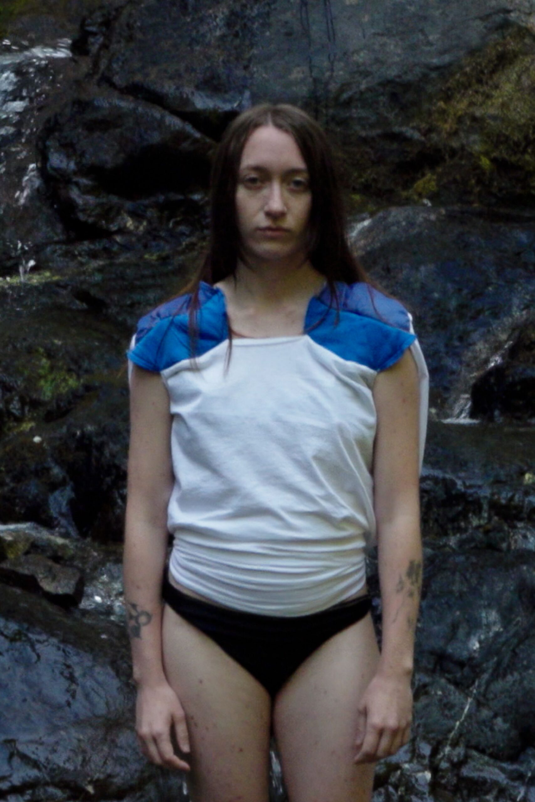 white and blue fitted top with black swimsuit