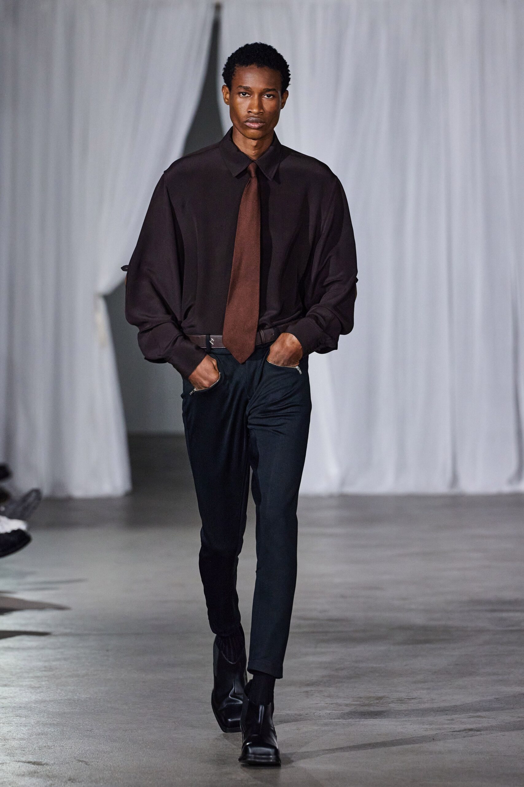 black relaxed shirt with blue pants