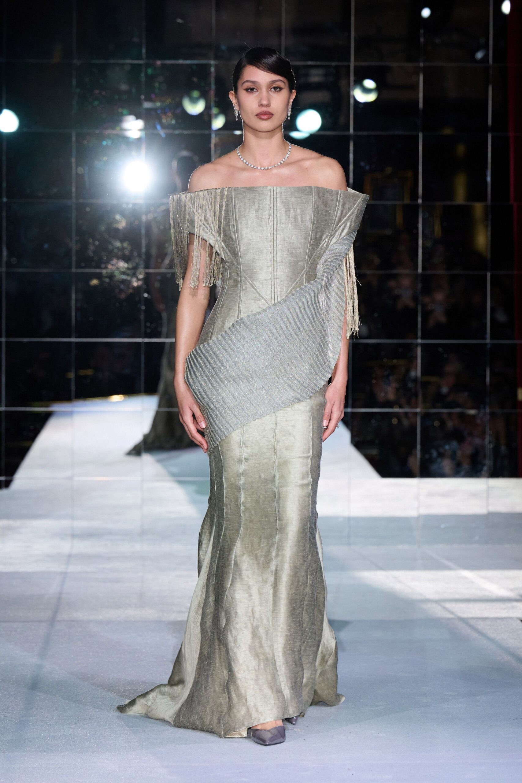 gray silk off-shoulder fitted pleated fringed shiny gown