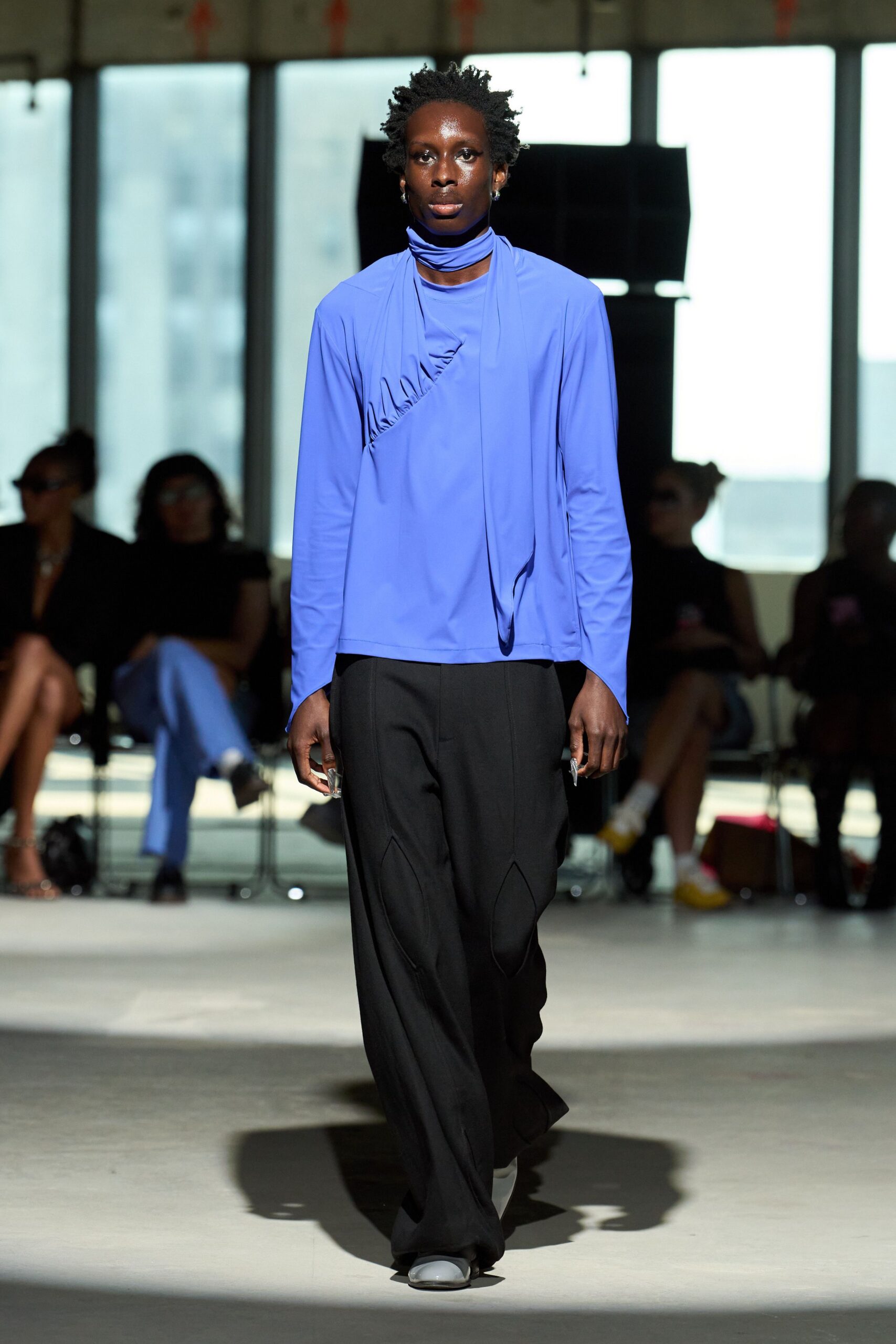 blue relaxed top with black pants