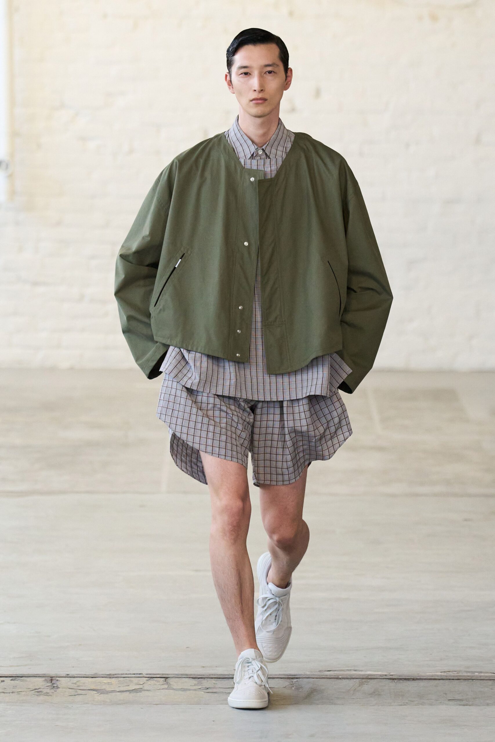 green relaxed jacket with checked shirt and shorts