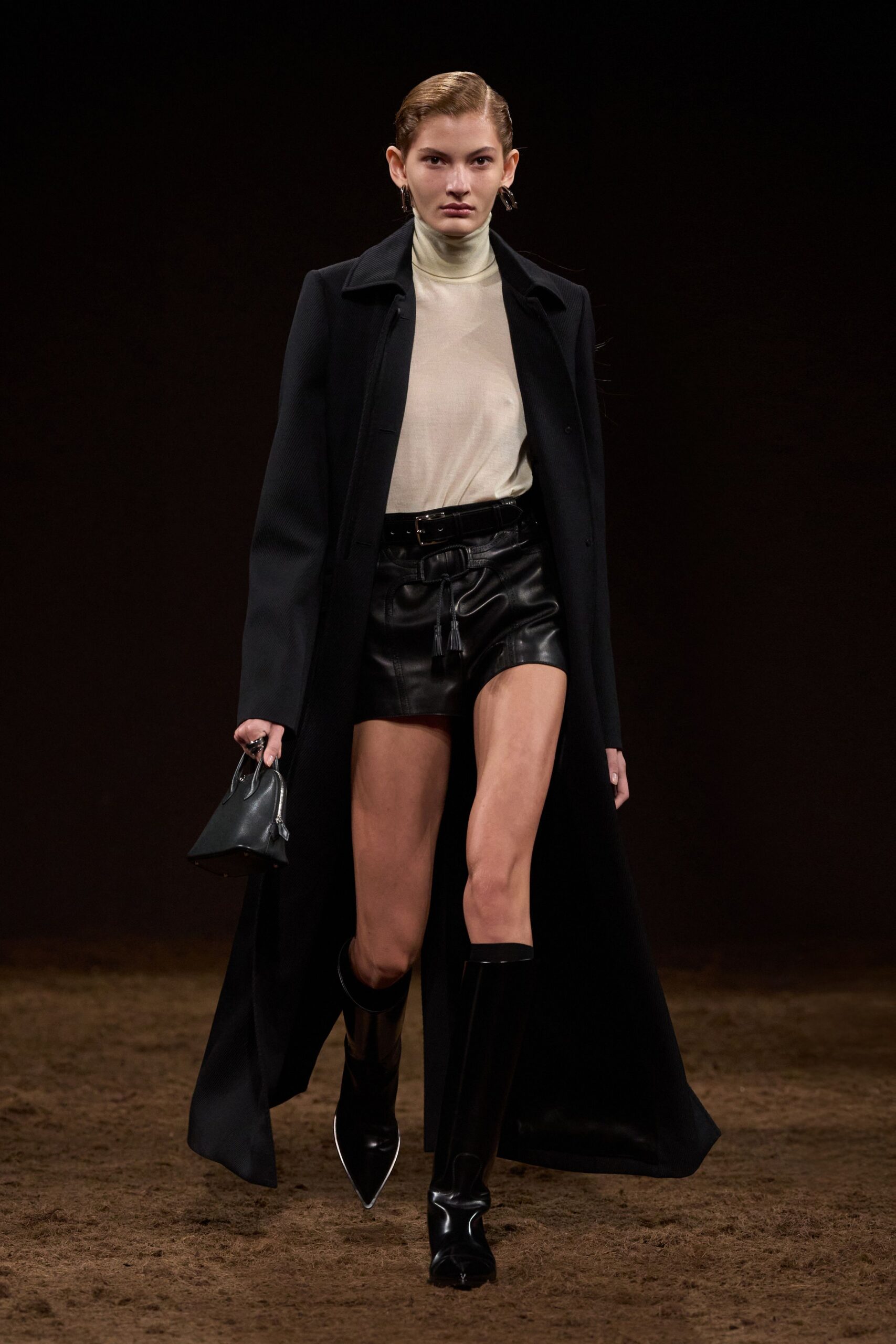 black coat white turtleneck leather shorts