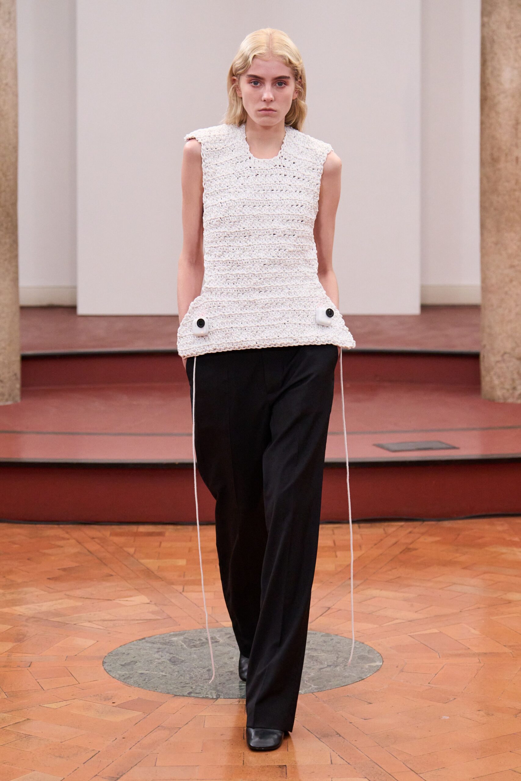 white relaxed top with black pants