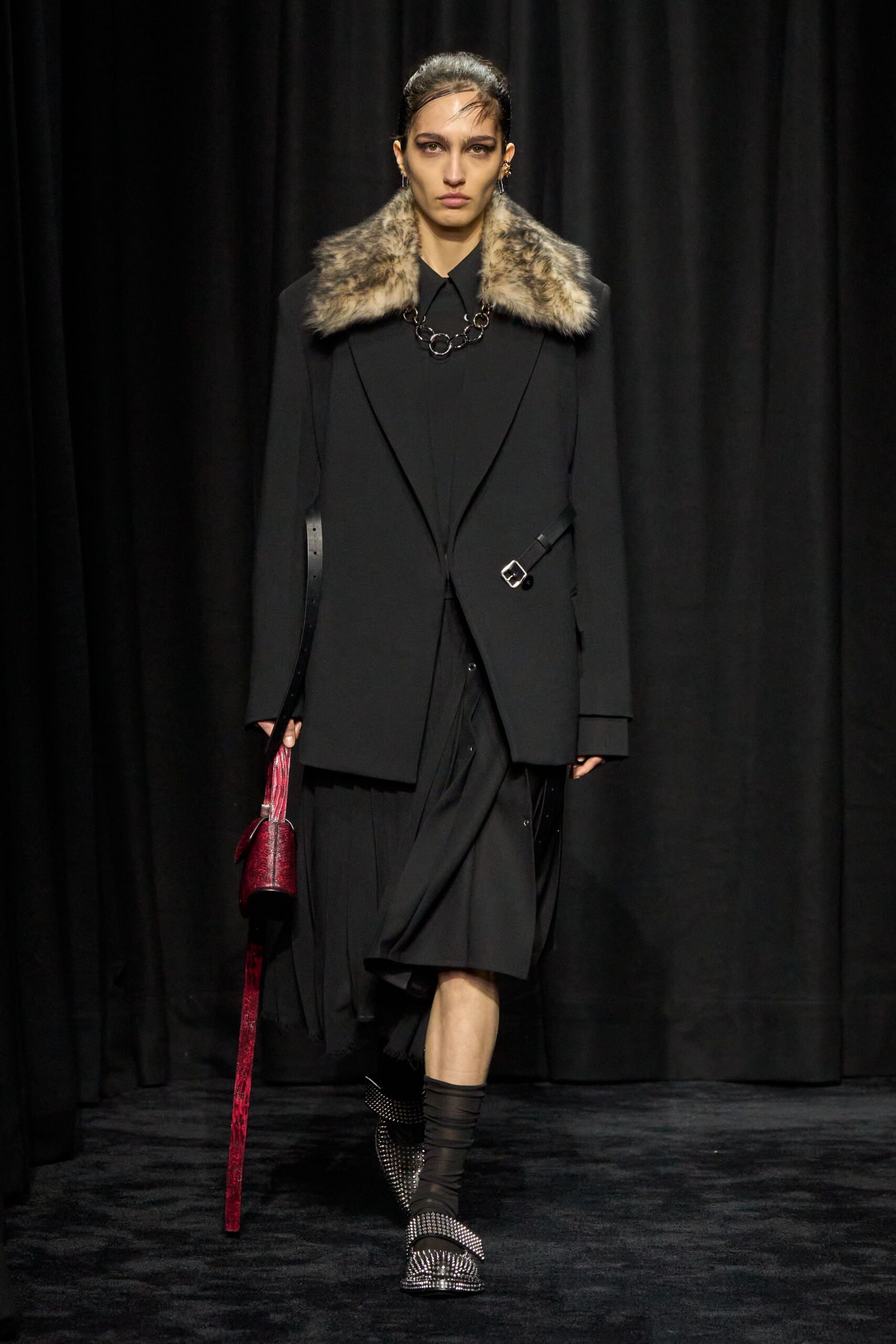 black wool coat with pleated dress