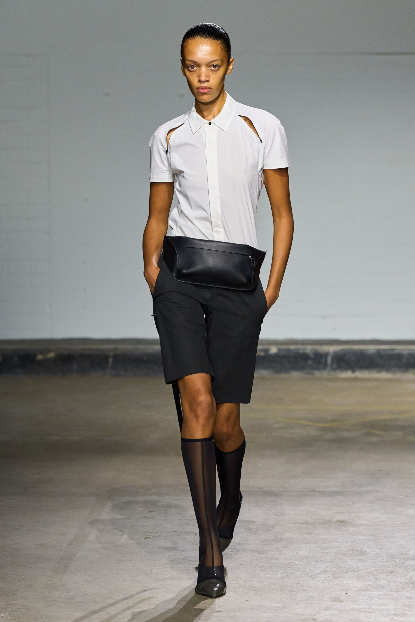white fitted shirt with black shorts