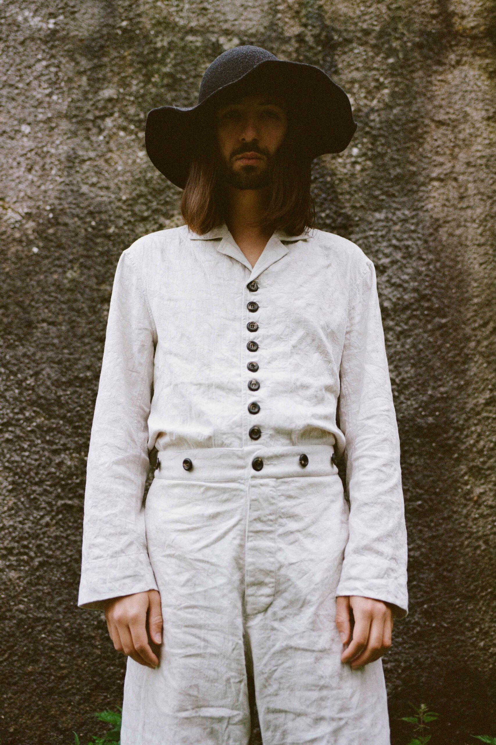 white linen long-sleeve collared relaxed buttoned jumpsuit