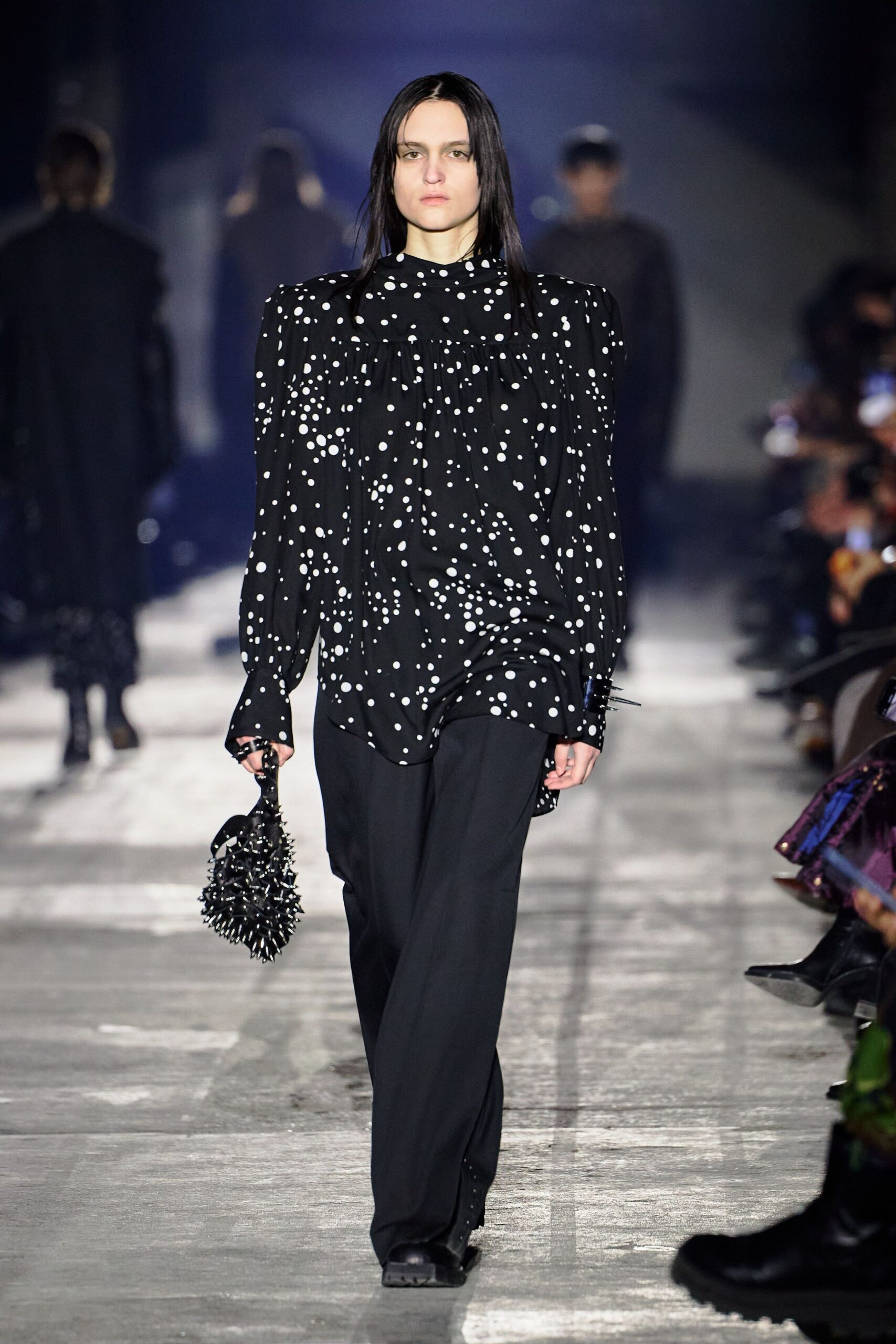 black polka-dot shirt with relaxed pants