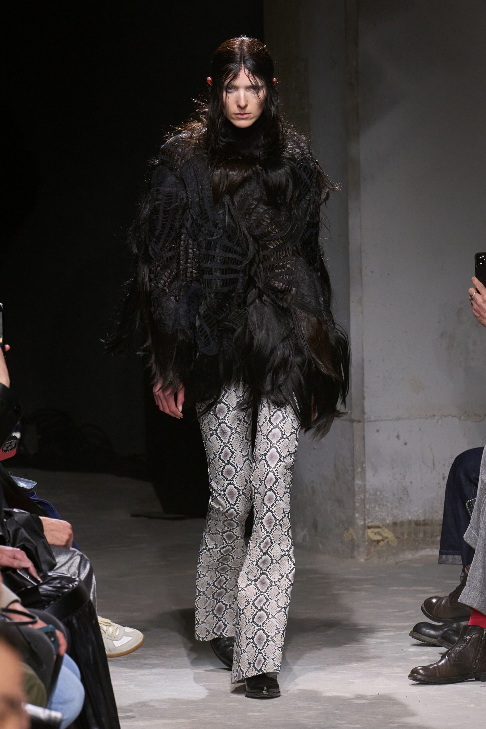 black oversized fur top with flared pants